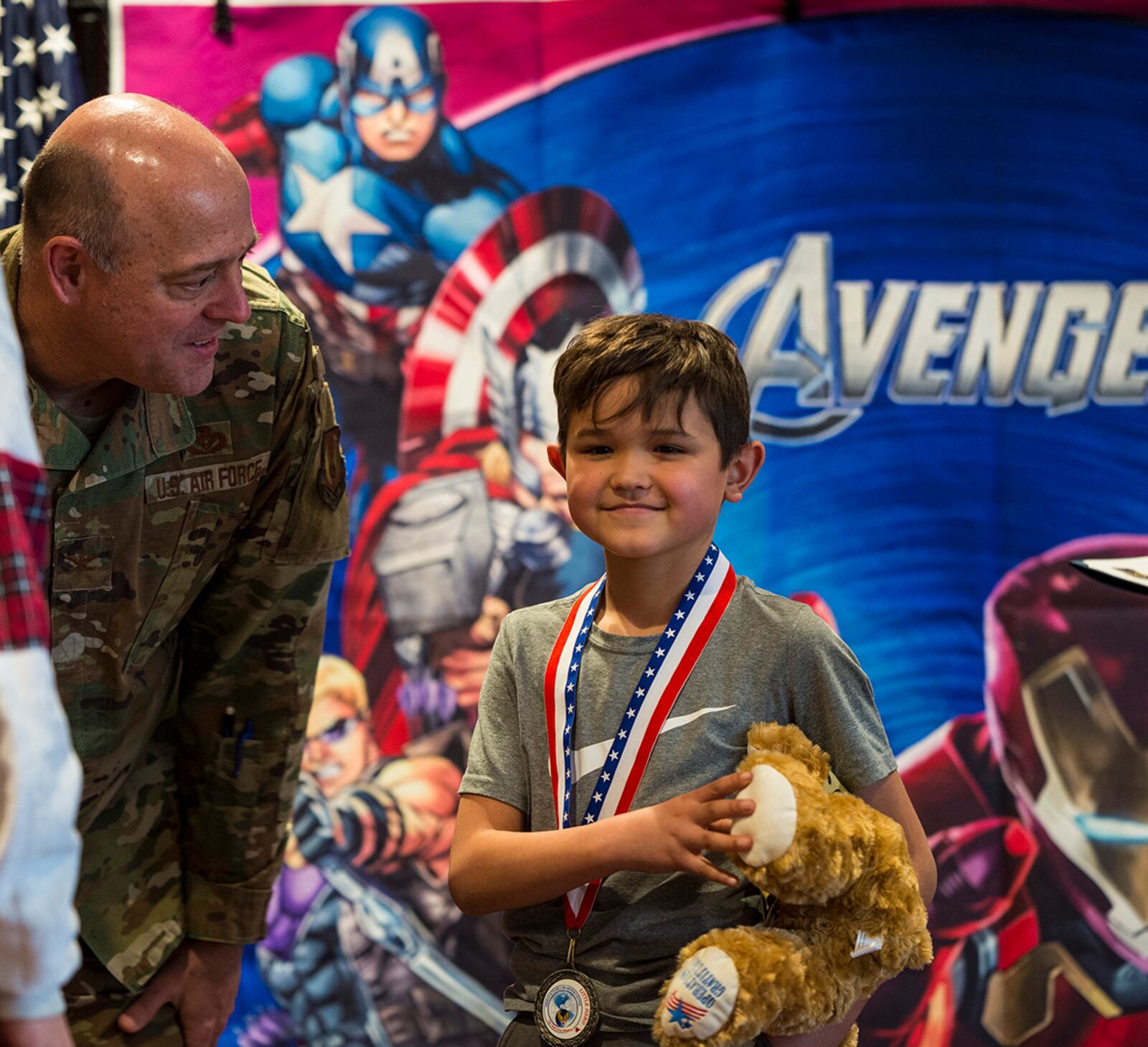 Col. Patrick Miller, 88th Air Base Wing and installation commander, speaks to a child during the “Little Heroes” celebration April 8. U.S. AIR FORCE PHOTO/JAIMA FOGG