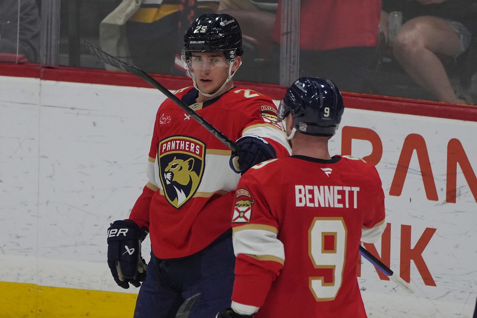 Florida Panthers right wing Mackie Samoskevich (25) celebrates his goal with center Sam Bennett (9) during the second period of an NHL hockey game against the Columbus Blue Jackets, Thursday, March 6, 2025, in Sunrise, Fla. (AP Photo/Marta Lavandier)