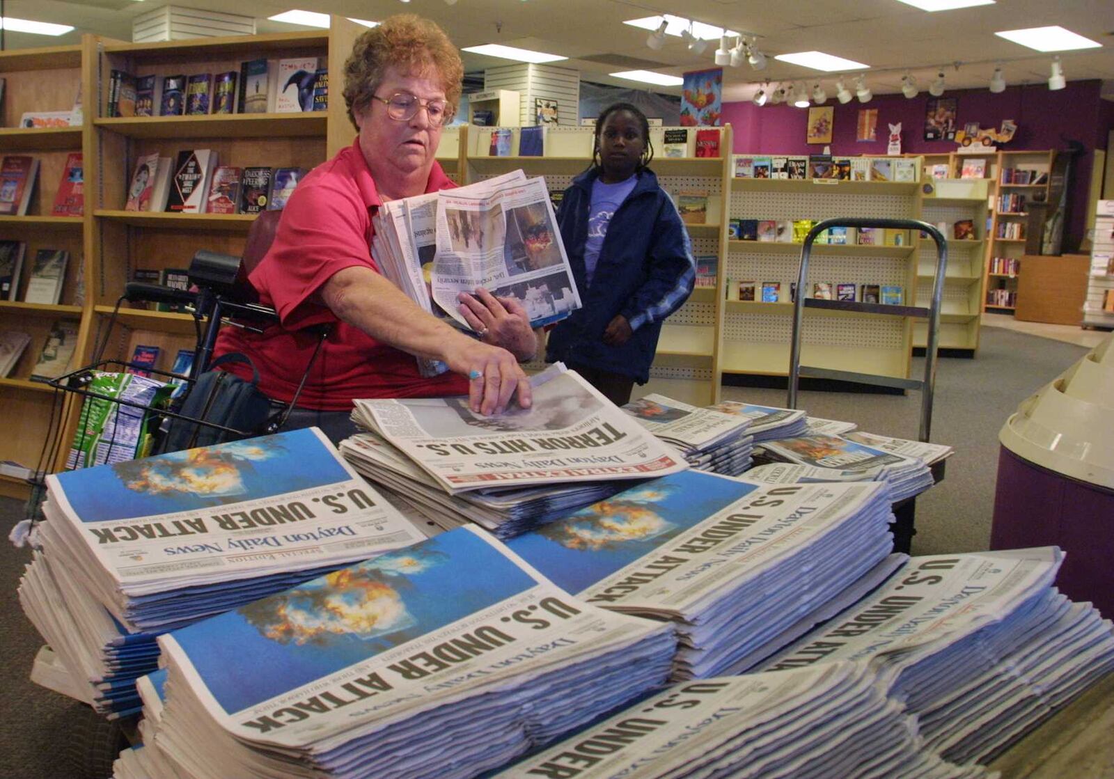 Twenty years ago, Connie Hammond made a special trip from her home in Huber Heights to downtown Dayton  to buy  20 newspapers for herself and her neighbors so they could read about the terrorist attacks in the country. LISA POWELL / STAFF