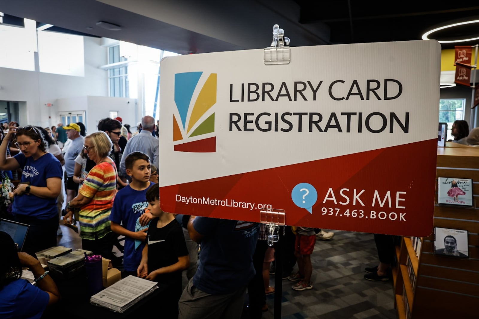 People lineup to get library cards following the grand opening celebration of the new Dayton Metro Library Huber Heights Branch Friday June 2, 2023. JIM NOELKER/STAFF