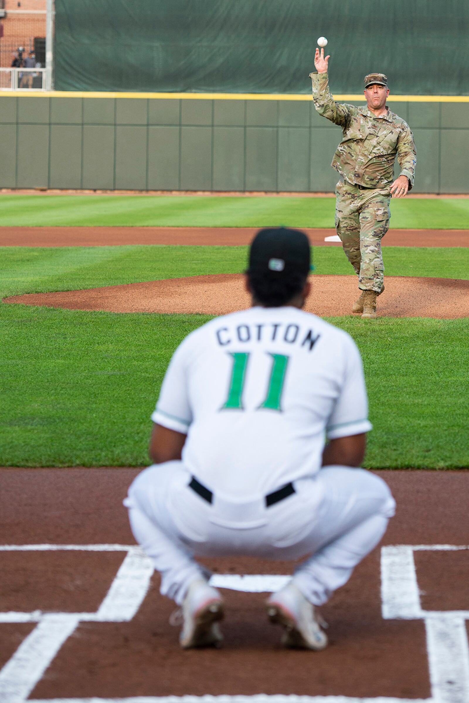 Col. Patrick Miller, 88th Air Base Wing and Wright-Patterson Air Force Base commander, throws out a ceremonial first pitch as part of pregame festivities during the Dayton Dragons Hometown Heroes Night event Aug. 21 at Day Air Credit Union Ballpark. U.S. AIR FORCE PHOTO/WESLEY FARNSWORTH