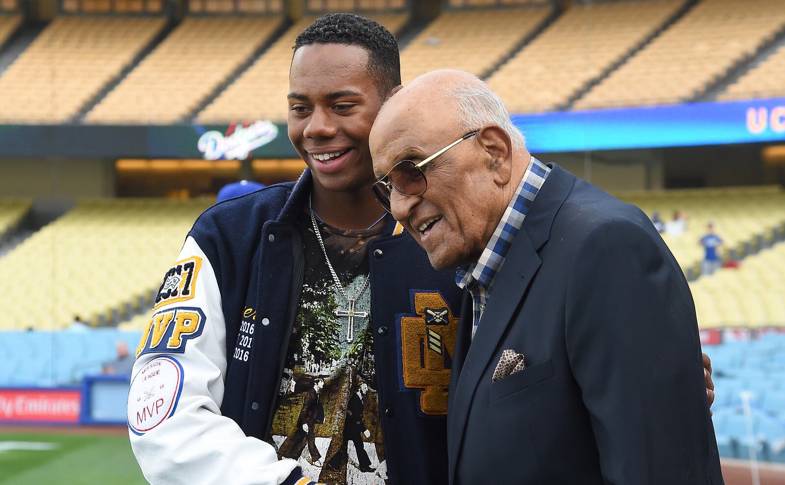 Hunter Greene meets Hall of Famer Don Newcombe during batting practice before the game last spring in Los Angeles. GETTY IMAGES