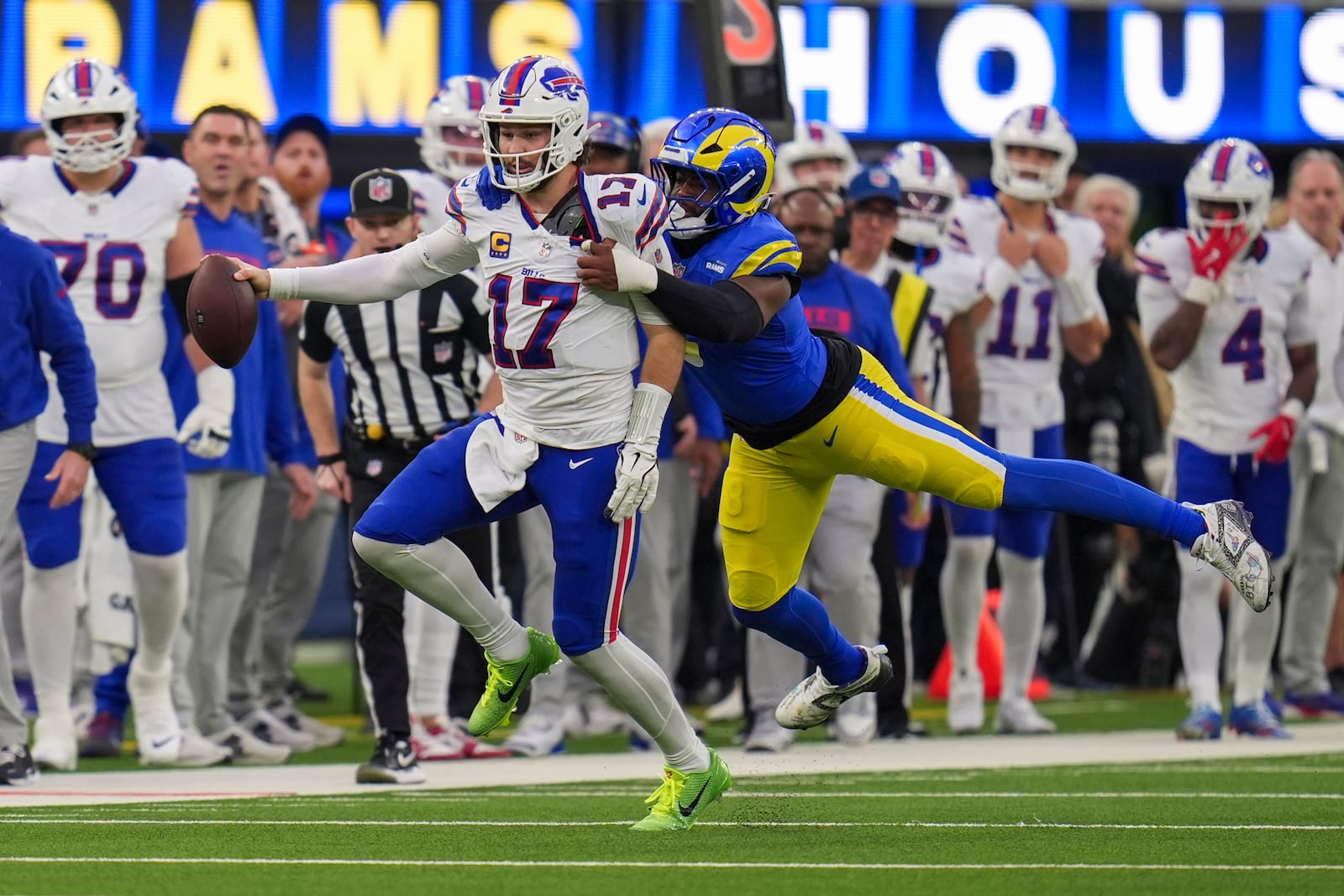 Buffalo Bills quarterback Josh Allen (17) is hit by Los Angeles Rams linebacker Jared Verse during the second half of an NFL football game, Sunday, Dec. 8, 2024, in Inglewood, Calif. (AP Photo/Gregory Bull)