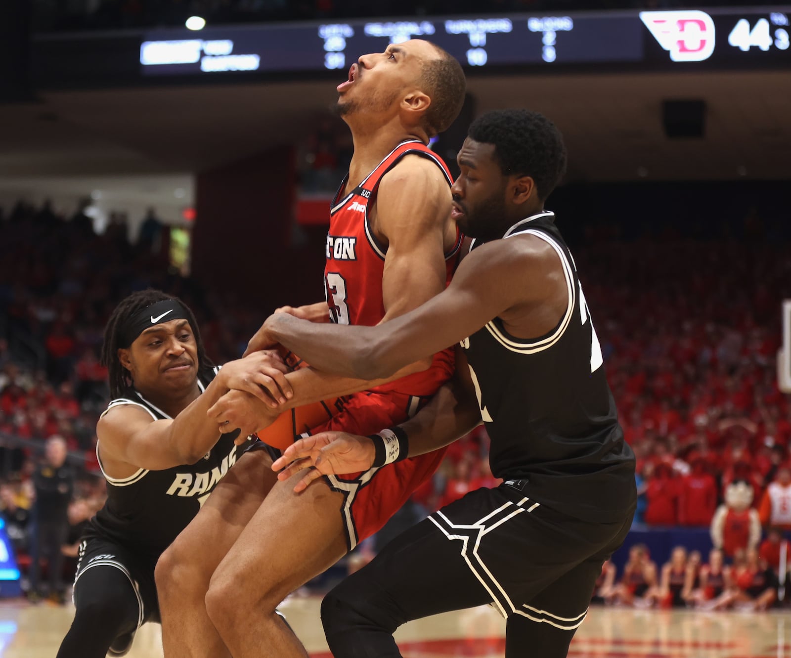 Dayton's Zed Key tries to hang onto the ball during the second half against Virginia Commonwealth on Friday, Feb. 7, 2025, at UD Arena.. David Jablonski/Staff