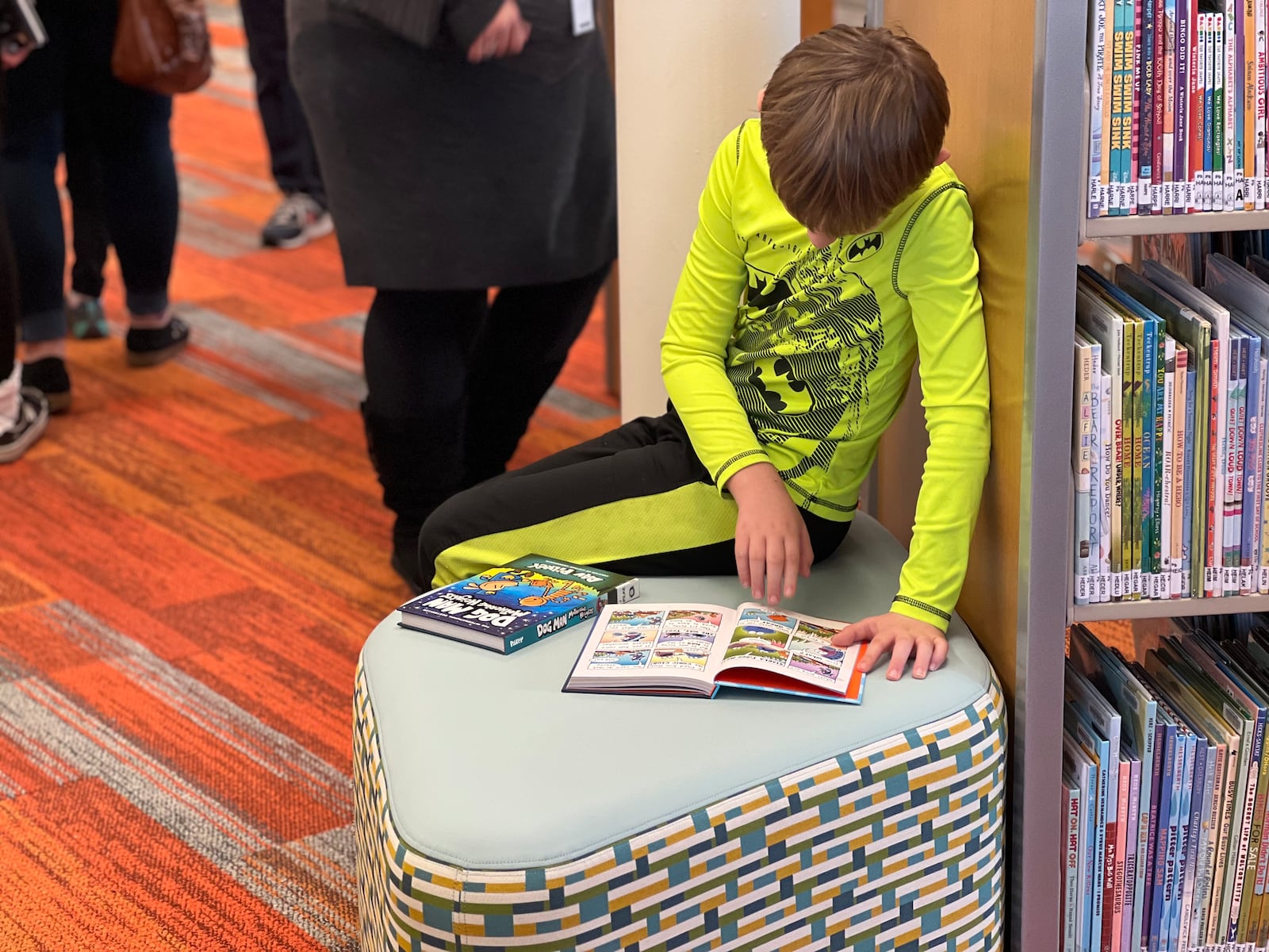 Children attending Saturday's grand opening of the Dayton Metro Library Northmont Branch were excited to choose from the wide selection of books. AIMEE HANCOCK/STAFF