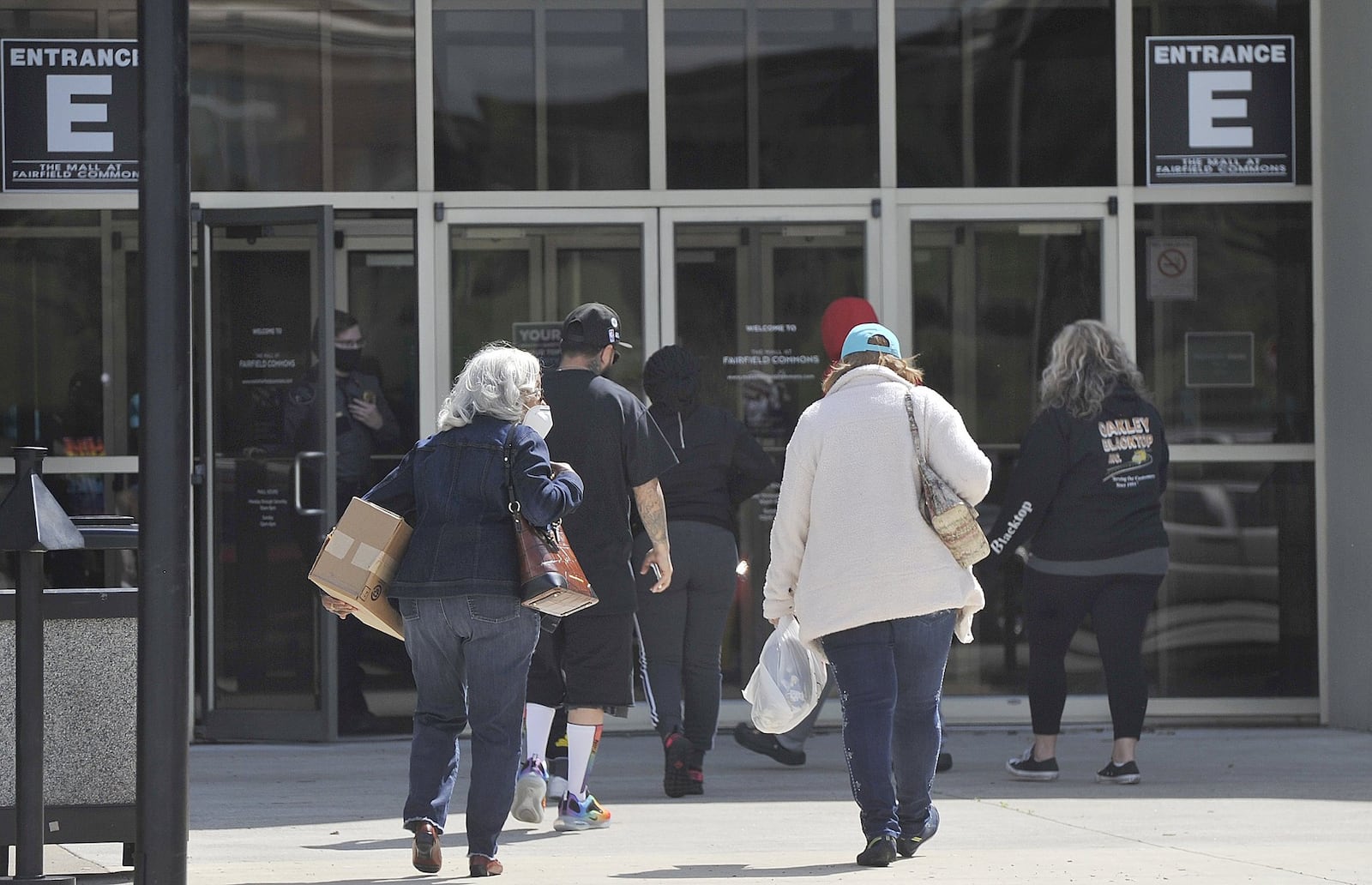 Shoppers waited outside the Fairfield Commons, Beavercreek Mall Tuesday for the doors to open for the frist time since March. MARSHALL GORBYSTAFF