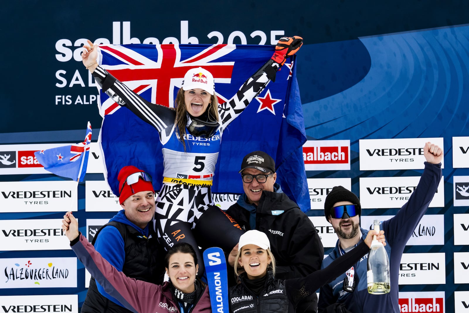 New Zealand's Alice Robinson celebrates with the team after winning the silver medal in a a women's giant slalom, at the Alpine Ski World Championships, in Saalbach-Hinterglemm, Austria, Thursday, Feb. 13, 2025. (Jean-Christophe Bott/Keystone via AP)