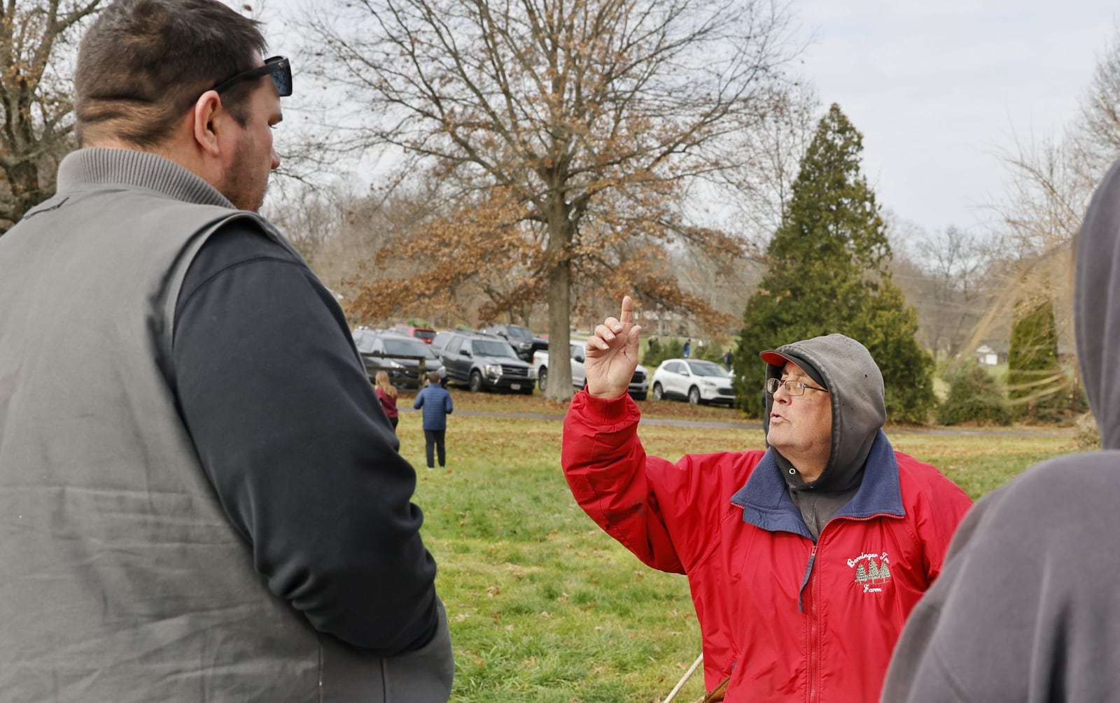 Peter Berninger, with Berninger Christmas Trees and Wreaths, helps customers locate trees Friday, Nov. 24, 2023 in Turtlecreek Twp. NICK GRAHAM/STAFF