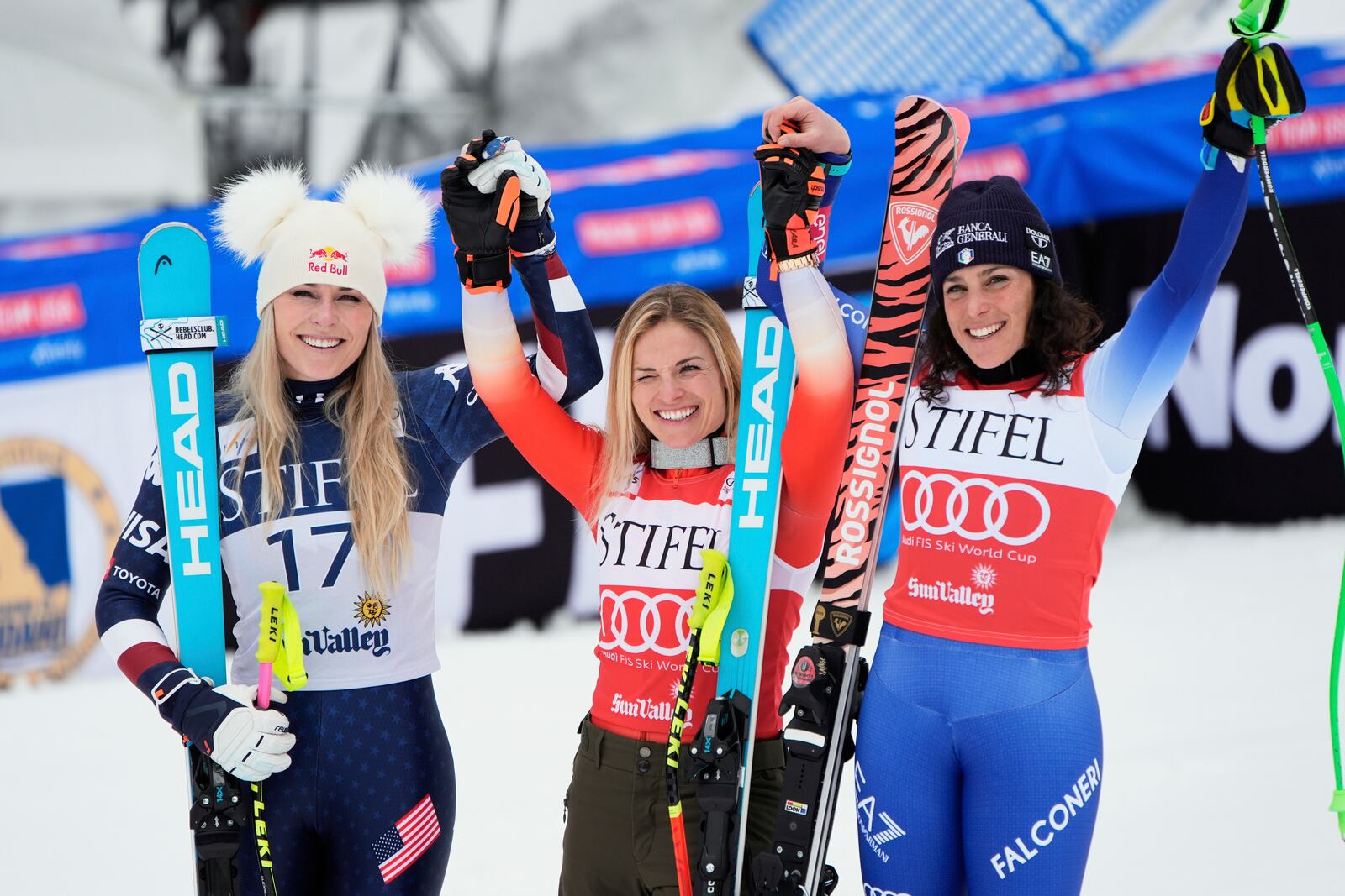 From left, second place finisher United States' Lindsey Vonn, first place finisher Switzerland's Lara Gut-Behrami, and third place finisher Italy's Federica Brignone pose for a photo during a medal ceremony for women's super-G at the World Cup Finals, Sunday, March 23, 2025, in Sun Valley, Idaho. (AP Photo/John Locher)