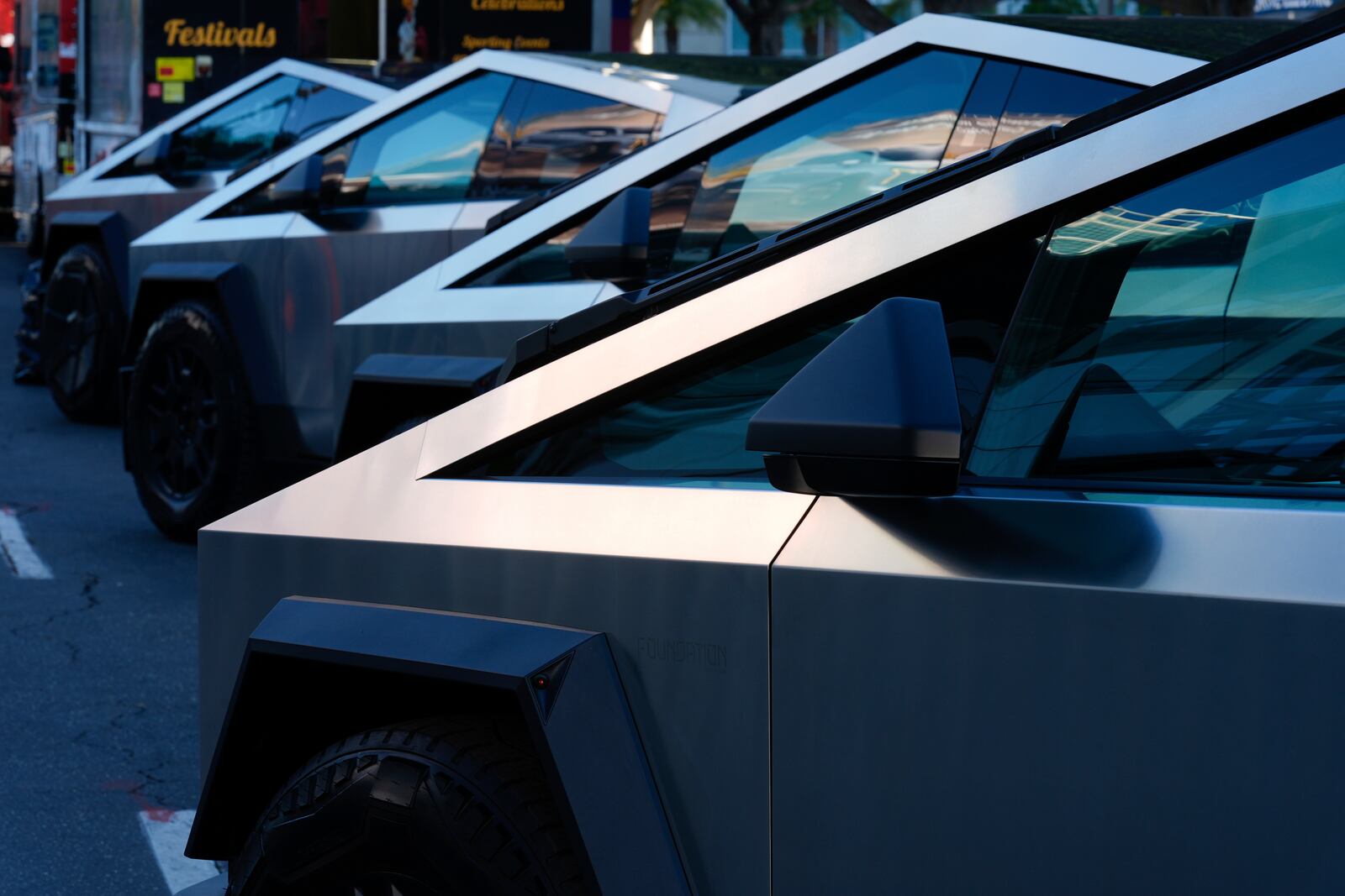 Tesla Cybertrucks are displayed at the AutoMobility LA Auto Show,Thursday, Nov. 21, 2024, in Los Angeles. (AP Photo/Damian Dovarganes)