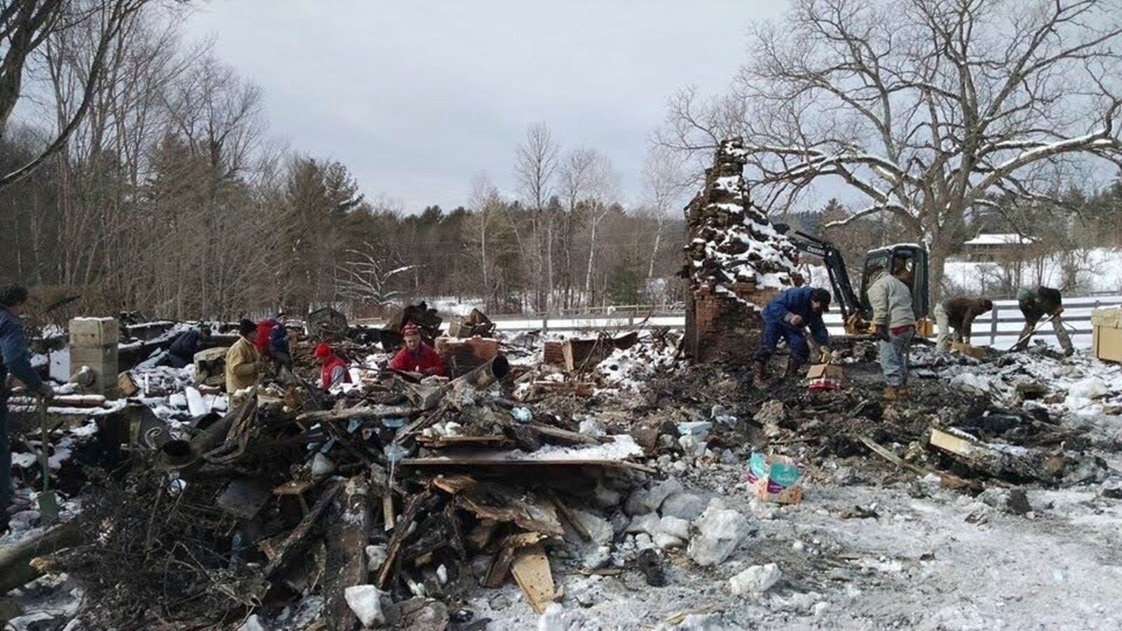 A “digging party” after the house fire in Lyme, N.H., in 2015, when friends came to help find things in the ashes. (Tecca family via AP)