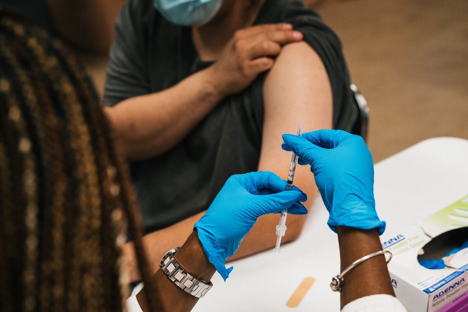 
                        FILE — A registered nurse prepares the COVID booster at a vaccine and booster event at the Quinn Center in Maywood, Ill., on Sept. 13, 2022. A committee of advisers to the Food and Drug Administration voted on Wednesday, June 5, 2024, to update the formula for the COVID-19 vaccine ahead of an anticipated fall immunization campaign, now an annual step to try to offer better protection against versions of the virus in circulation. (Jamie Kelter Davis/The New York Times)
                      