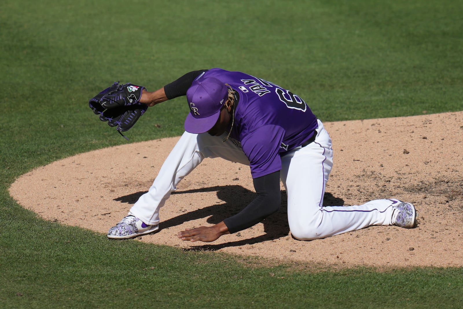 Colorado Rockies pitcher Jefry Yan celebrates a strikeout against Seattle Mariners Jacob Nottingham during the seventh inning of a spring training baseball game, Sunday, March 2, 2025, in Scottsdale, Ariz. (AP Photo/Ross D. Franklin)