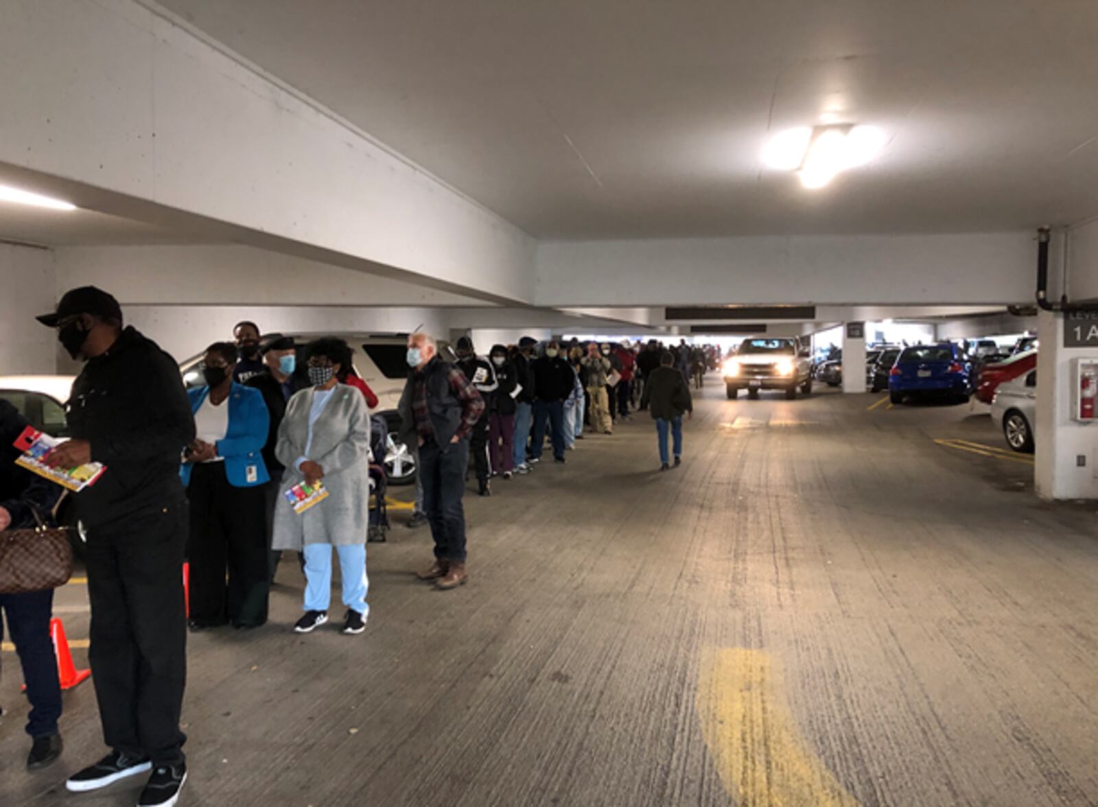 Dozens of people lined up early at the Montgomery County Board of Elections Tuesday morning to cast their ballot. Oct. 6 marked the beginning of early voting in Ohio. STAFF PHOTO / LYNN HULSEY