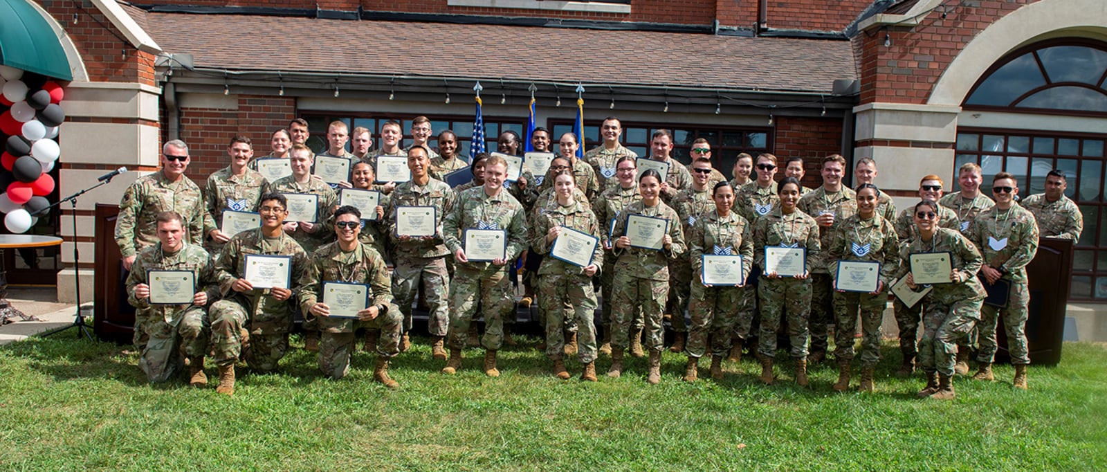 The 2022 Staff Sergeant selects take a group photo outside of the Wright-Patt Club during the Staff Sergeant Release Party, Sept. 2 at Wright-Patterson Air Force Base. Wright-Patt had 69 Senior Airman selected to the rank of staff sergeant. U.S. AIR FORCE PHOTO/SENIOR AIRMAN JACK GARDNER