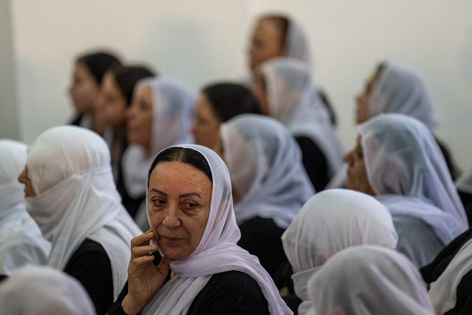 Women from the Israeli Druze minority mourn during the funeral of Israeli Colonel Ehsan Daxa in Daliyat al-Carmel, Israel, Monday, Oct. 21, 2024. Daxa, 41, was killed during Israel's ground operation in the Gaza Strip, where the Israeli army has been battling Palestinian militants in the war ignited by Hamas' Oct. 7 2023 attack into Israel. (AP Photo/Ariel Schalit)