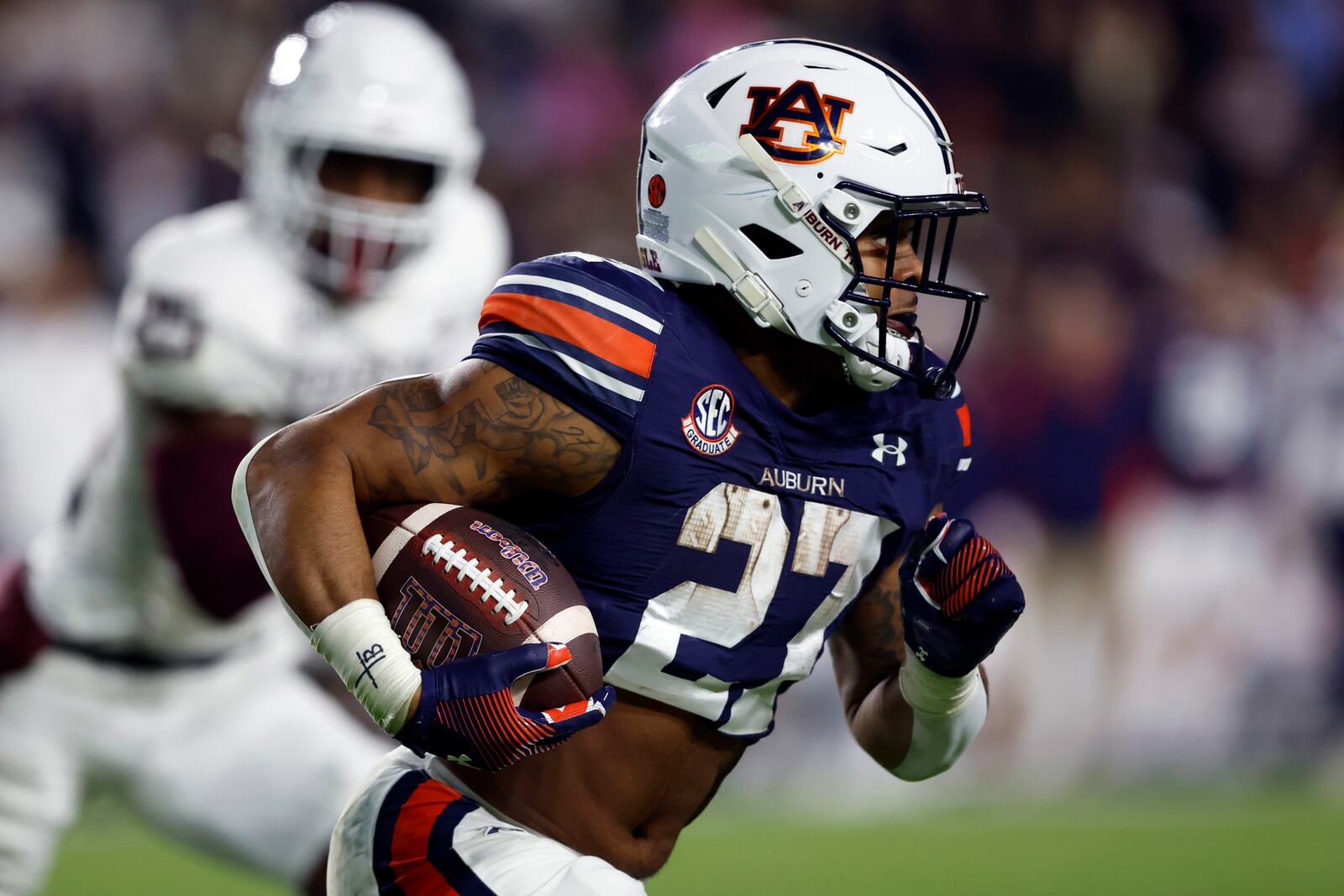 Auburn running back Jarquez Hunter (27) carries the ball against Texas A&M during the first half of an NCAA college football game, Saturday, Nov. 23, 2024, in Auburn, Ala. (AP Photo/Butch Dill)