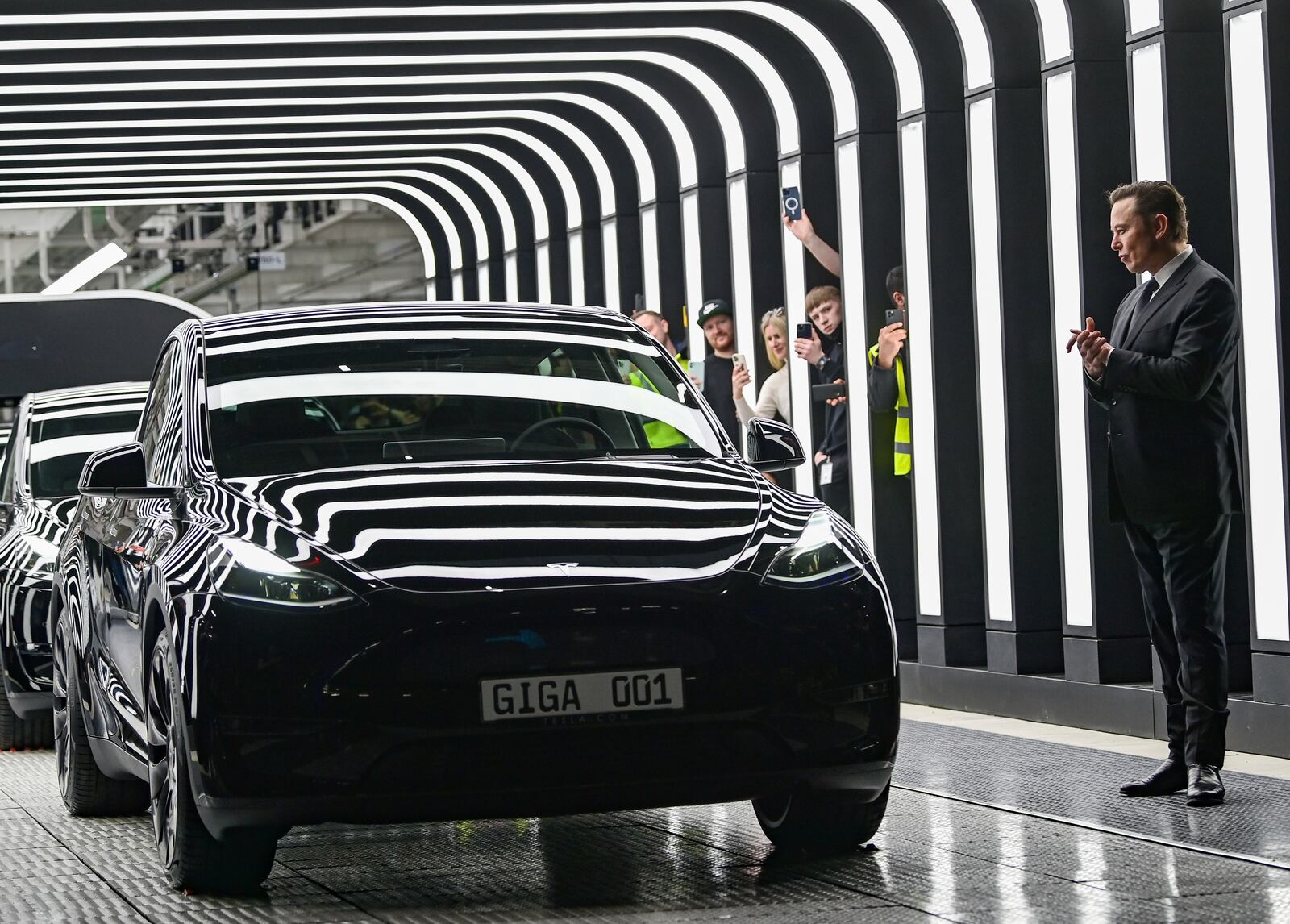 FILE - Tesla CEO Elon Musk claps hands at the opening of the Tesla factory Berlin Brandenburg in Gruenheide, Germany, Tuesday, March 22, 2022. (Patrick Pleul/Pool Photo via AP, File)