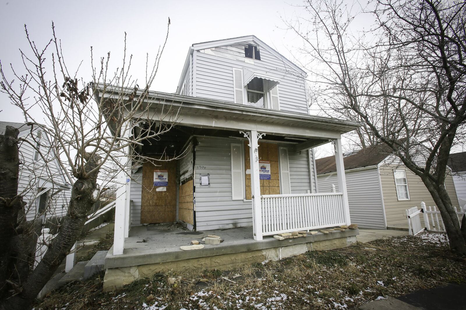 The City of Hamilton plans to soon tear down the house on Pater Ave. where Hamilton Firefighter Patrick Wolterman died in an arson fire. GREG LYNCH / STAFF