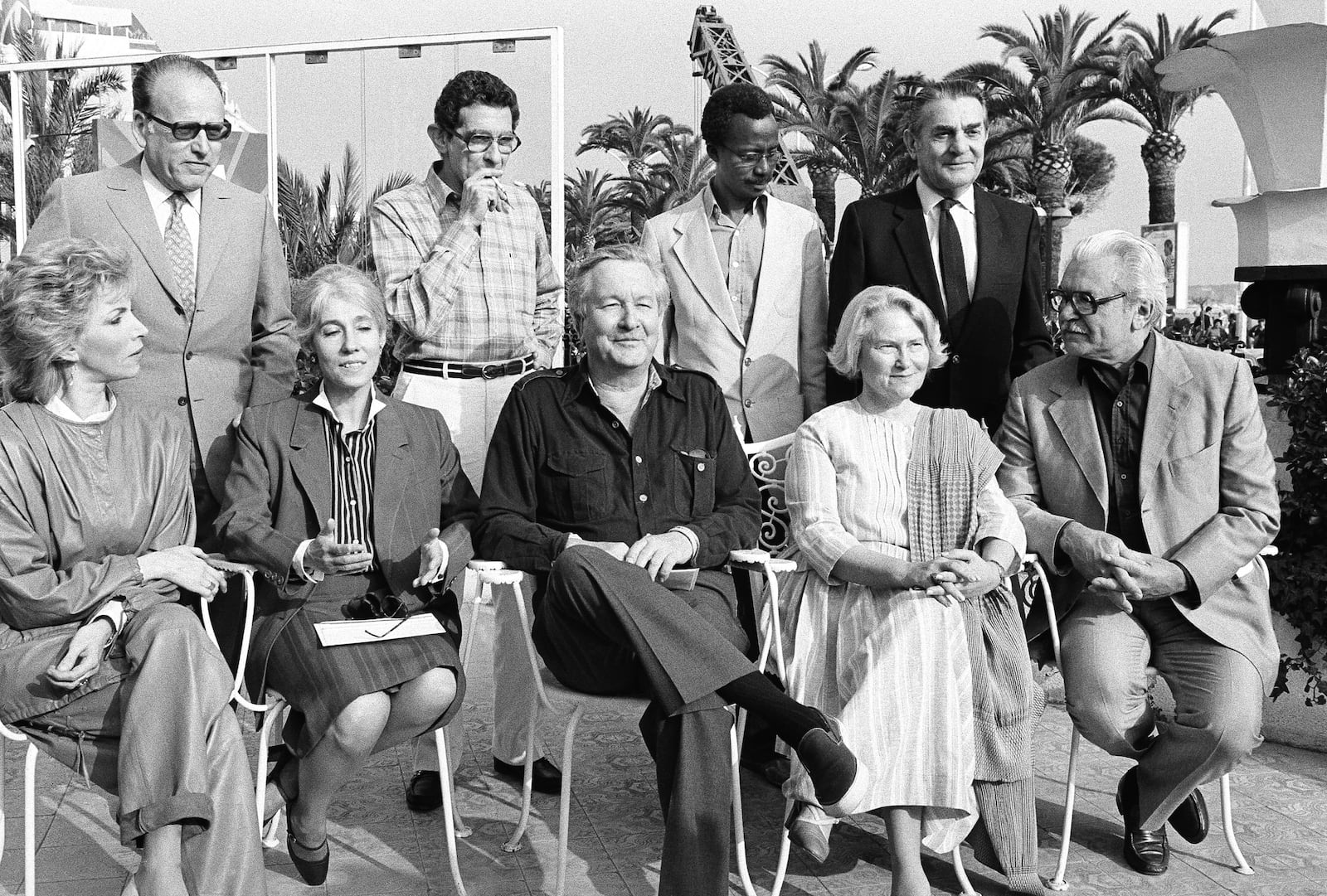 FILE - Jury members of the 36th international film festival posing together in Cannes, May 6, 1983 from left, front: Italian actress Naria Angela Melato, French film critic Yvonne Baby, American novelist William Styron, Israeli movie fan Lys Van Leer and Russian director Serge Bondartchouk. Standing, from left, are: French producer Gilbert de Goldschmidt, Egyptian director Youssef Chahine, Malian director Souleymane Cisse and French art director Henri Alekan. (AP Photo/J. Langevin, File)