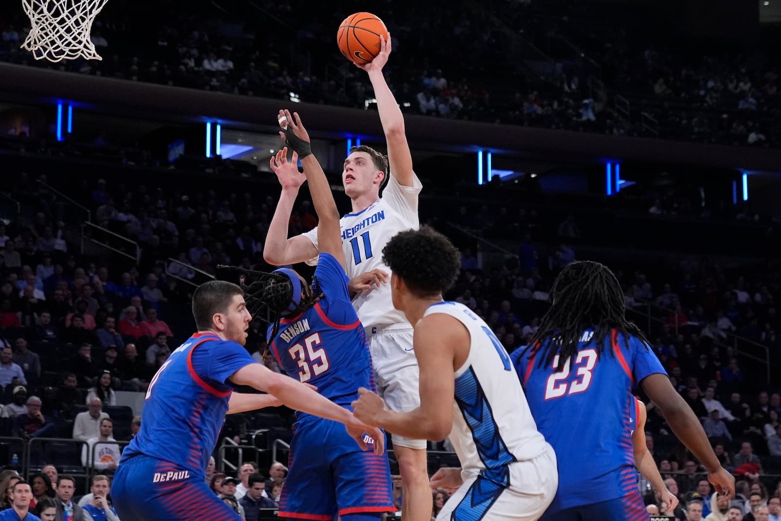 Creighton's Ryan Kalkbrenner (11) shoots over DePaul's NJ Benson (35) during the first half of an NCAA college basketball game at the Big East basketball tournament Thursday, March 13, 2025, in New York. (AP Photo/Frank Franklin II)