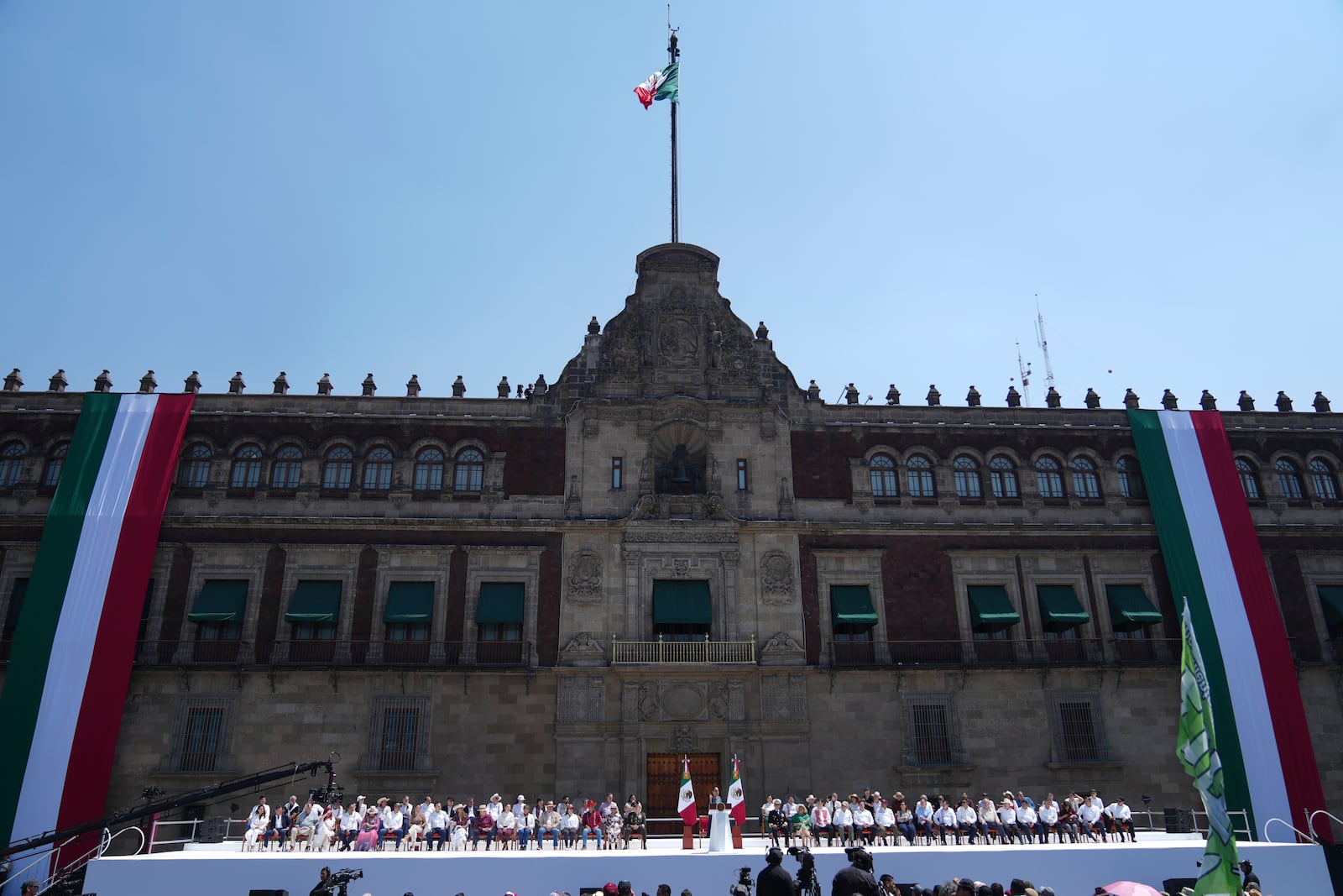 President Claudia Sheinbaum addresses supporters at a rally she convened to welcome U.S. President Donald Trump's decision to postpone tariffs on Mexican goods for one month at the Zocalo, Mexico City's main square, Sunday, March 9, 2025. (AP Photo/Eduardo Verdugo)