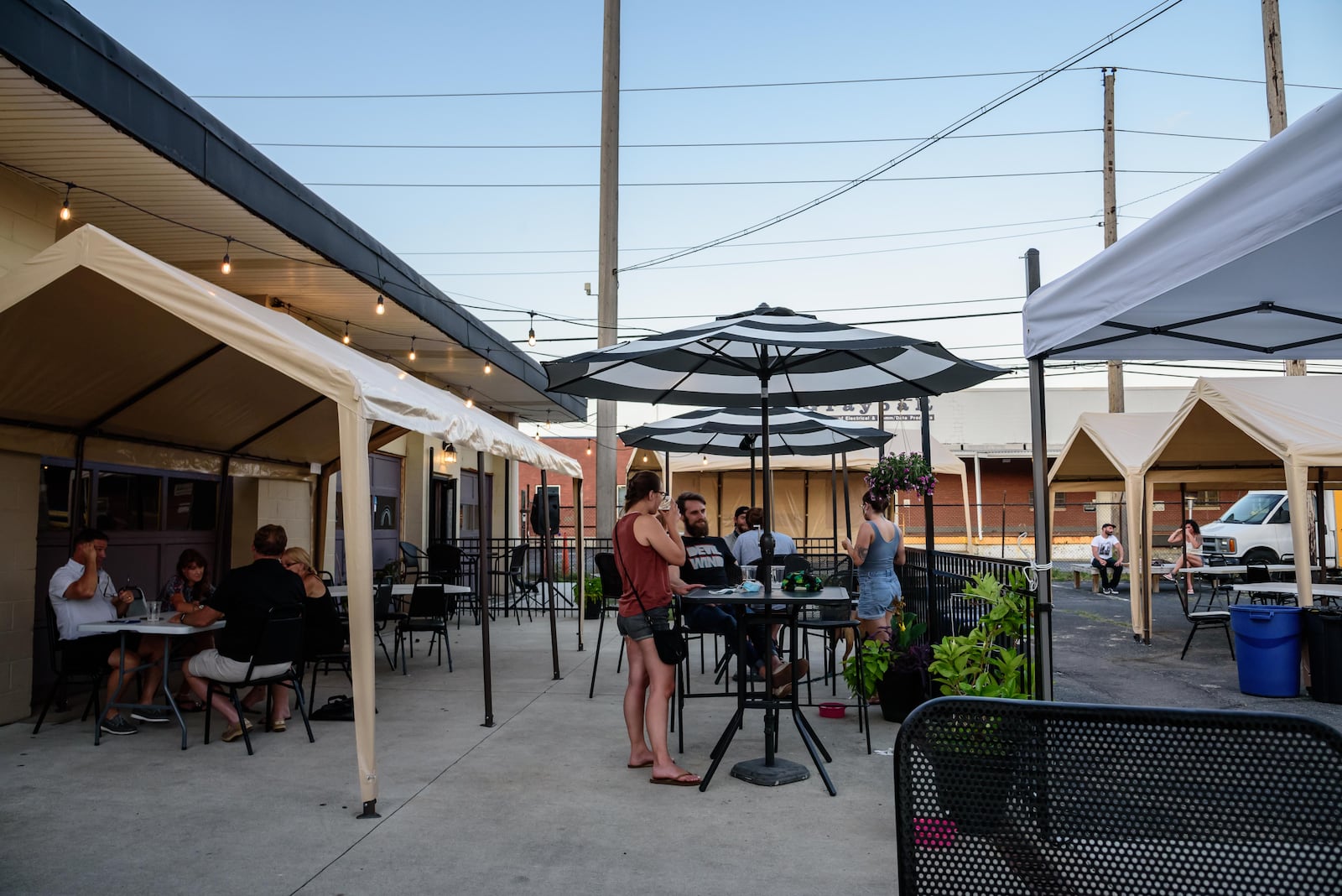 The Yellow Cab Tavern’s back parking is put to use as a giant outdoor patio. TOM GILLIAM/CONTRIBUTING