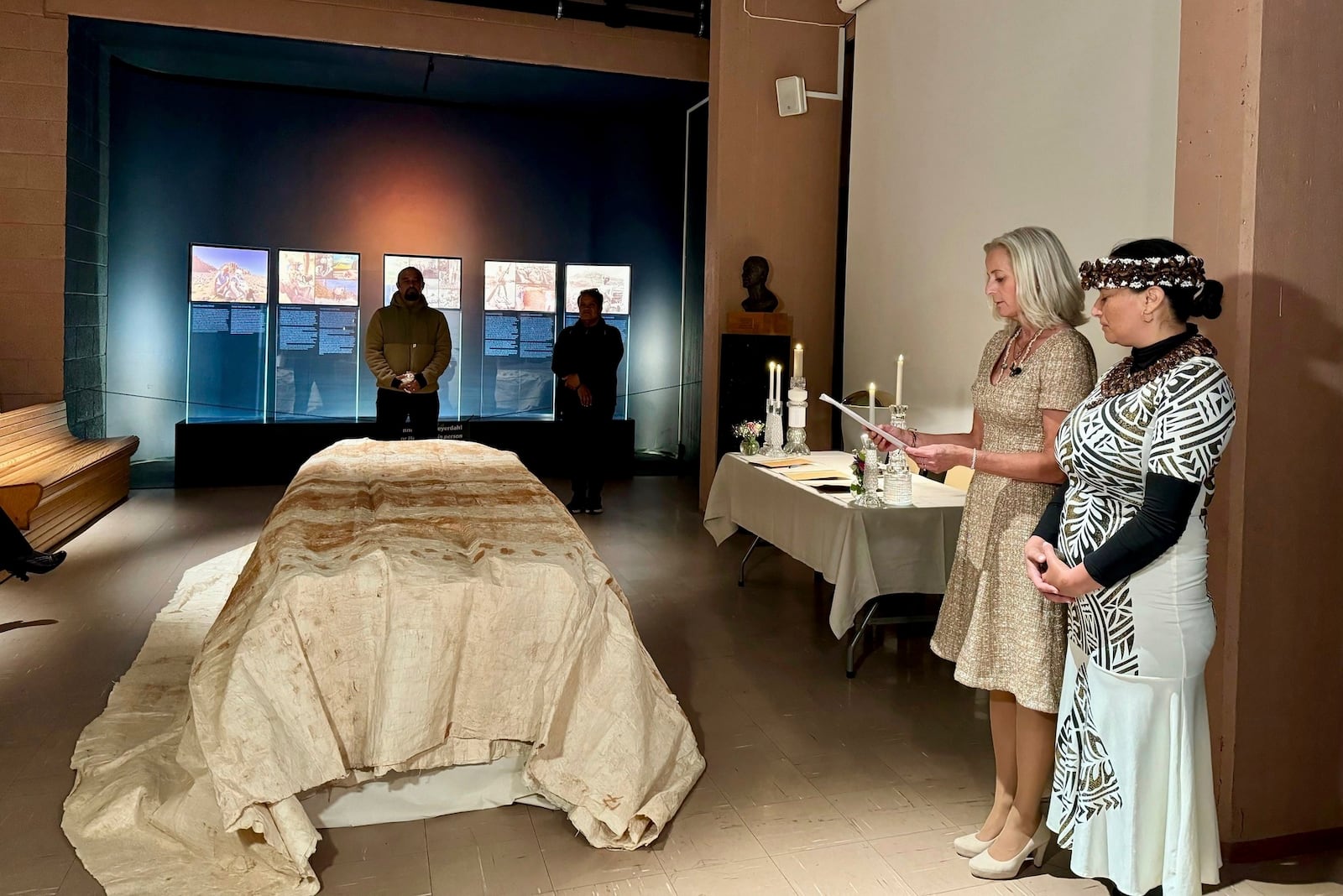 In this photo provided by the Kon-Tiki Museum press service on Wednesday, Nov. 13, 2024, head of the museum Liv Heyerdahl, second from right, attends the "repatriation" ceremony at the Kon Tiki Museum in Oslo, Norway, Tuesday, Nov. 12, 2024. (Kon-Tiki Museum press service via AP)