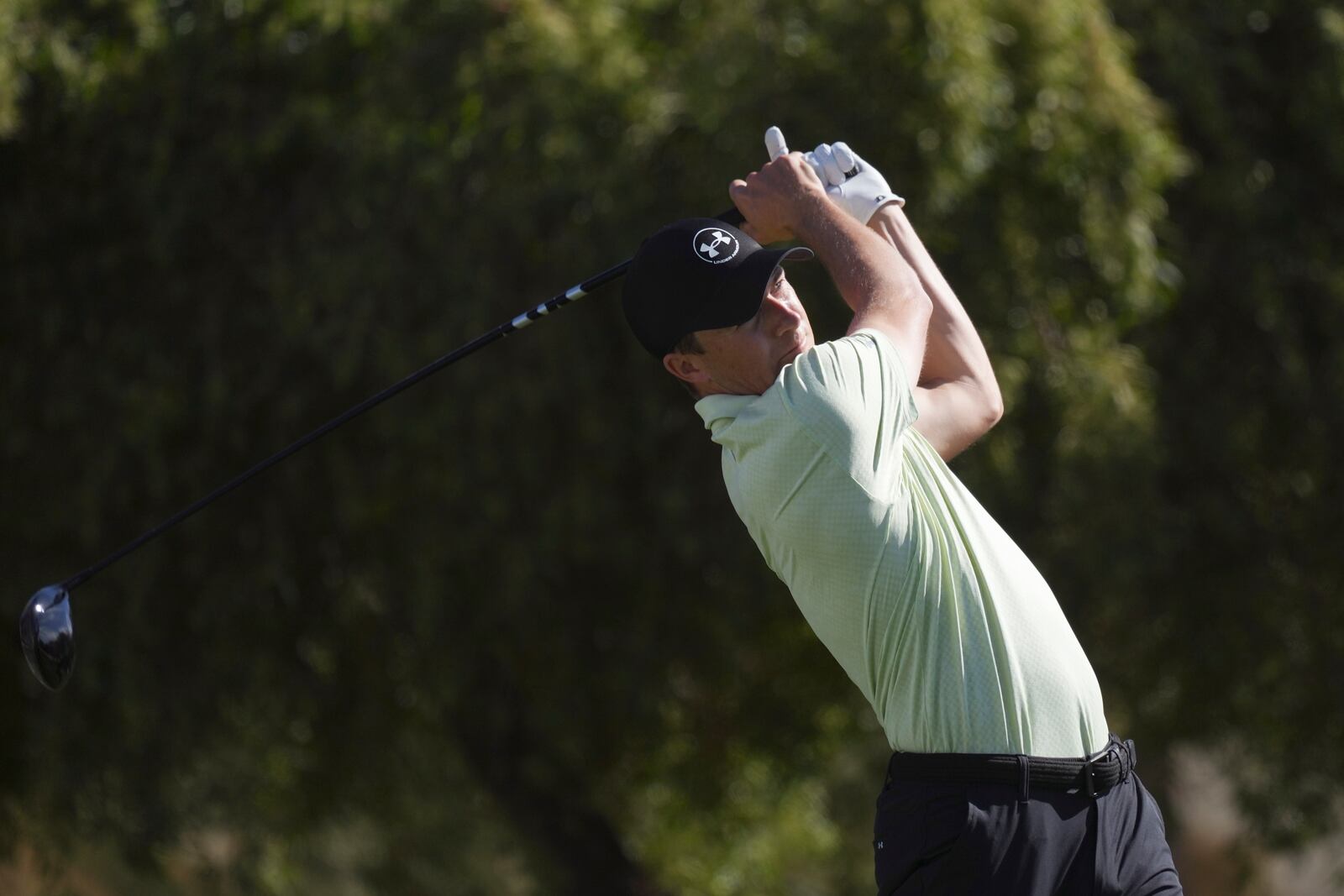 Jordan Spieth hits his tee shot on the fifth hole during the third round of the Phoenix Open golf tournament at TPC Scottsdale Saturday, Feb. 8, 2025, in Scottsdale, Ariz. (AP Photo/Ross D. Franklin)