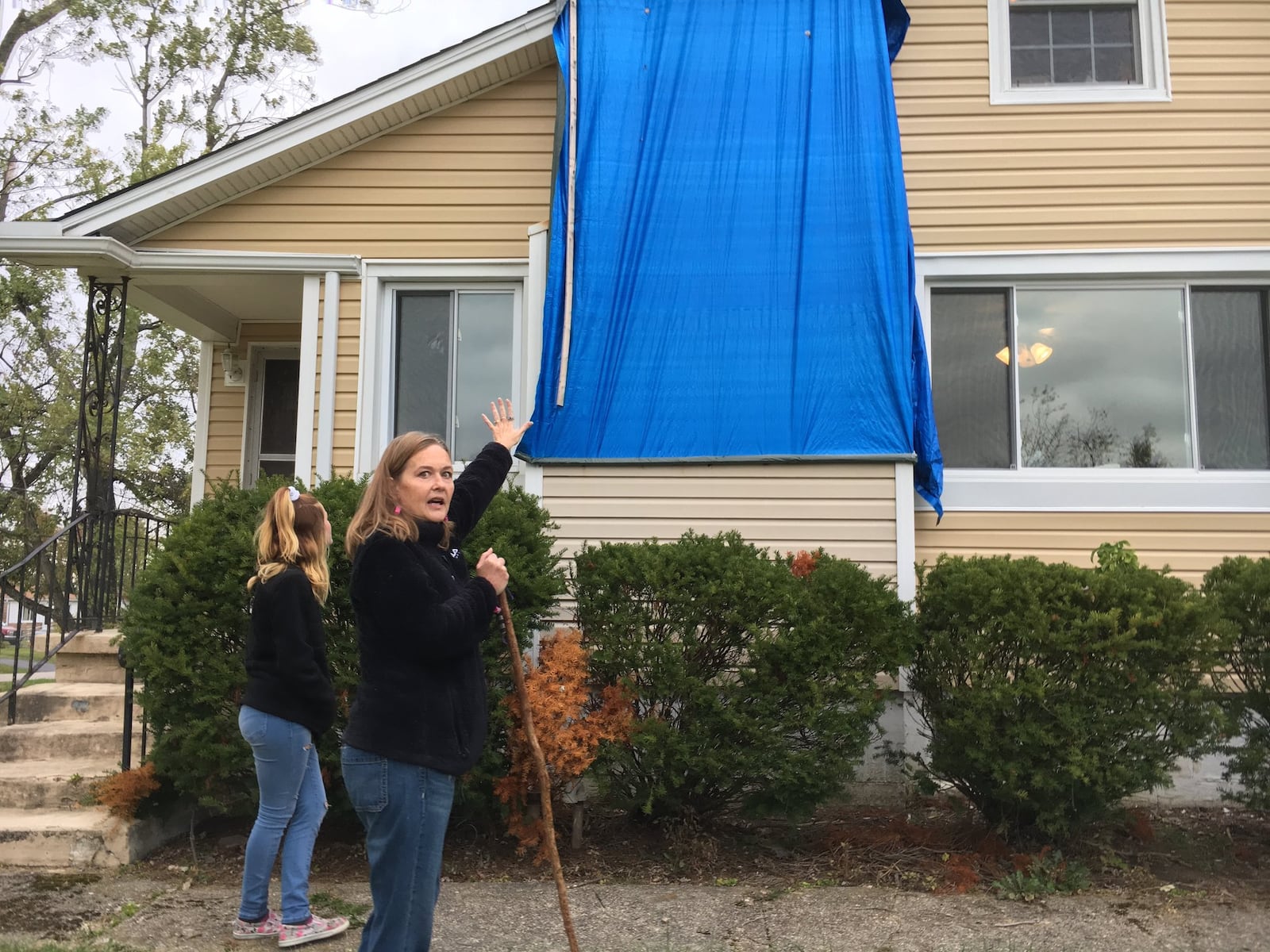 While most of the homes on her Beavercreek street have been repaired since the Memorial Day storms, Julia Stewart’s house continues to bear a blue tarp as she fights with her insurance company.