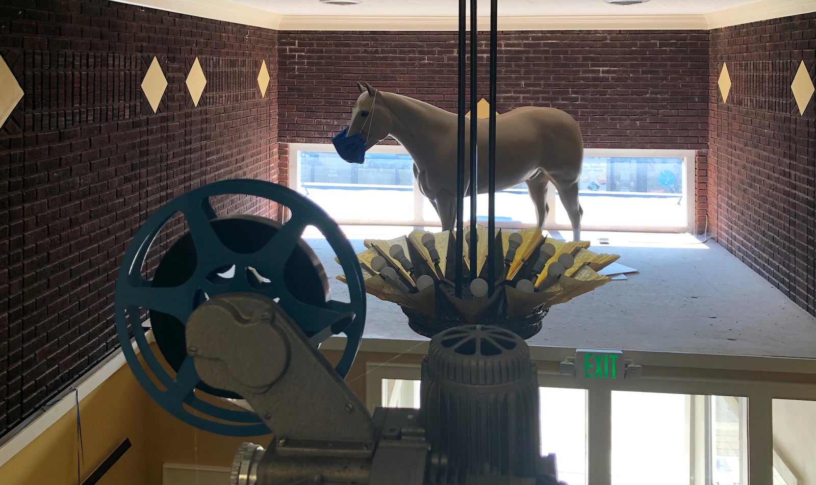 Pinkie the horse, the Miamisburg Plaza Theatre mascot, is wearing a mask to remind patrons to do the same. The fiberglass horse was an advertising symbol that sat on top of the theater marquis for 30 years. Today he welcomes visitors to the movies as the enter the theater. CONTRIBUTED