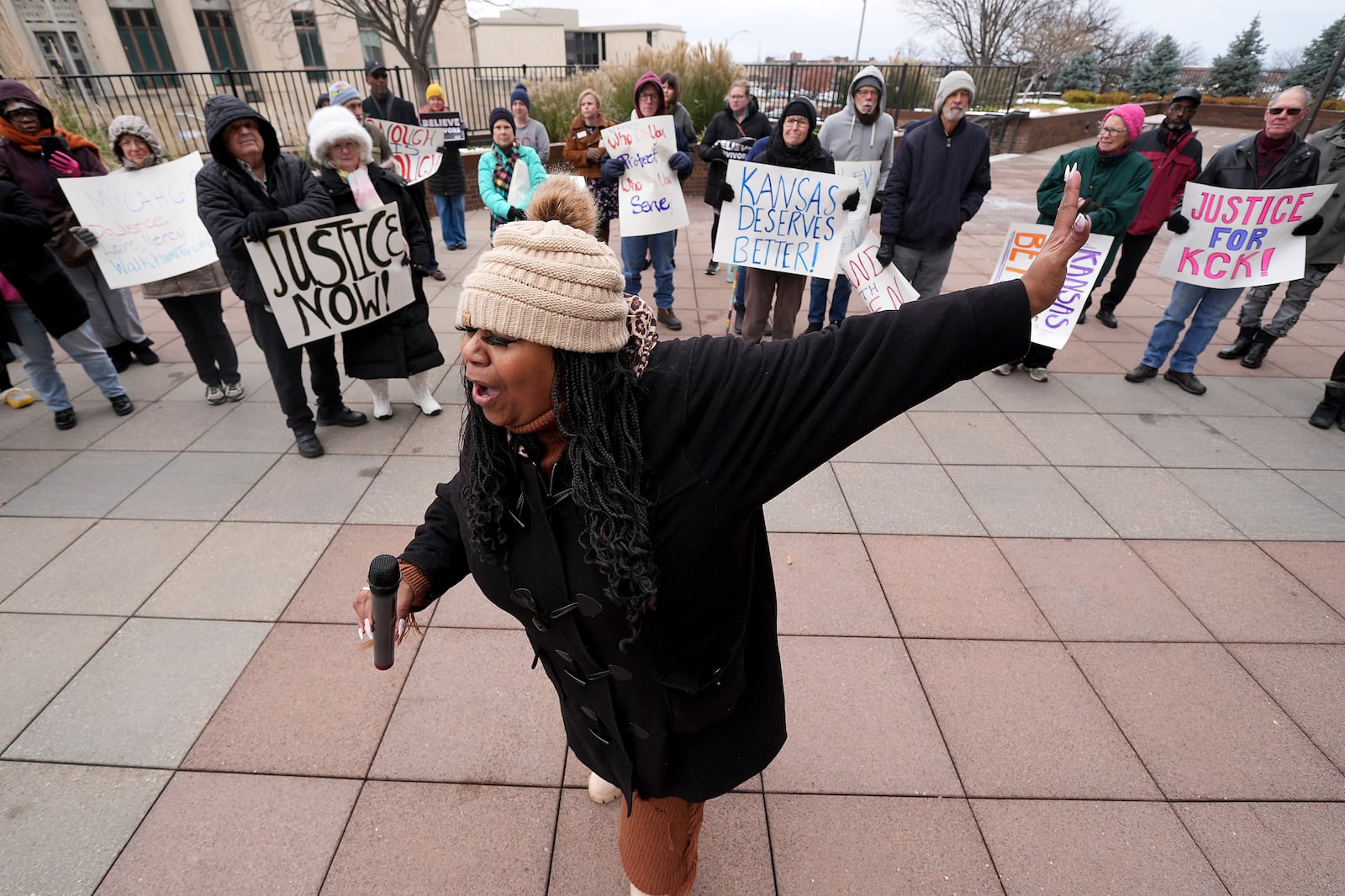 Laquanda Jacobs speaks at a rally outside the federal courthouse on what was to be the opening day of a trial for former police detective Roger Golubski, Monday, Dec. 2, 2024, in Topeka, Kan. (AP Photo/Charlie Riedel)