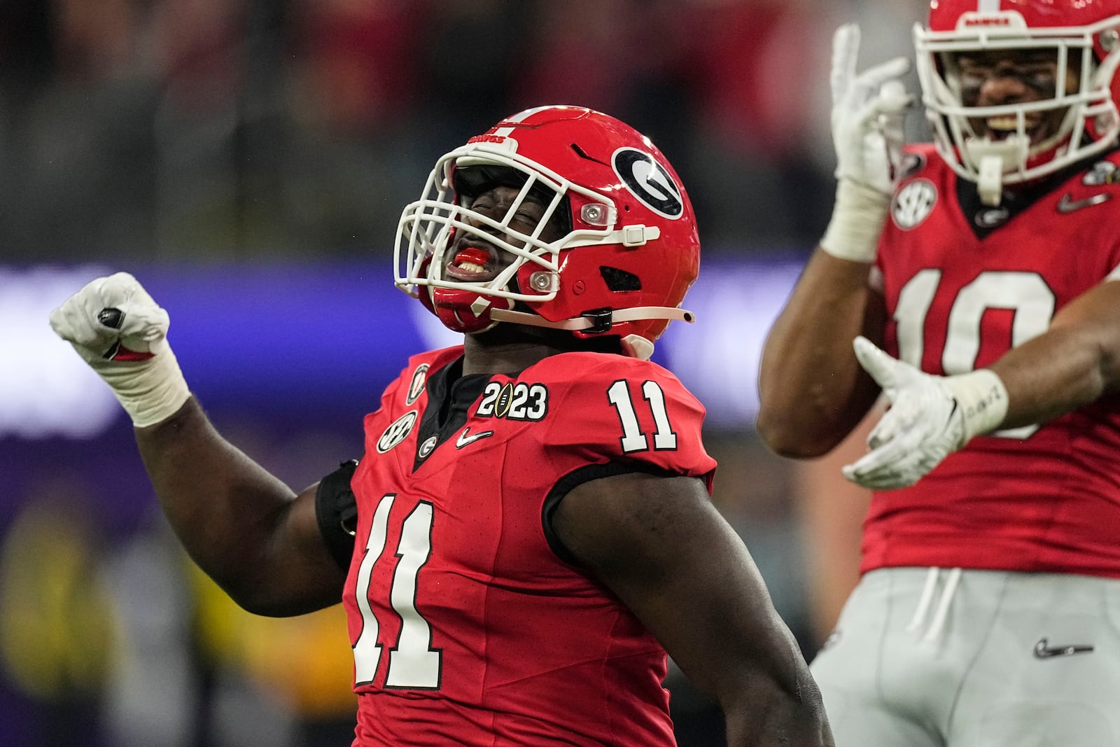 FILE - Georgia linebacker Jalon Walker (11) celebrates his sacking of TCU quarterback Max Duggan during the second half of the national championship NCAA College Football Playoff game, Jan. 9, 2023, in Inglewood, Calif. (AP Photo/Mark J. Terrill, File)