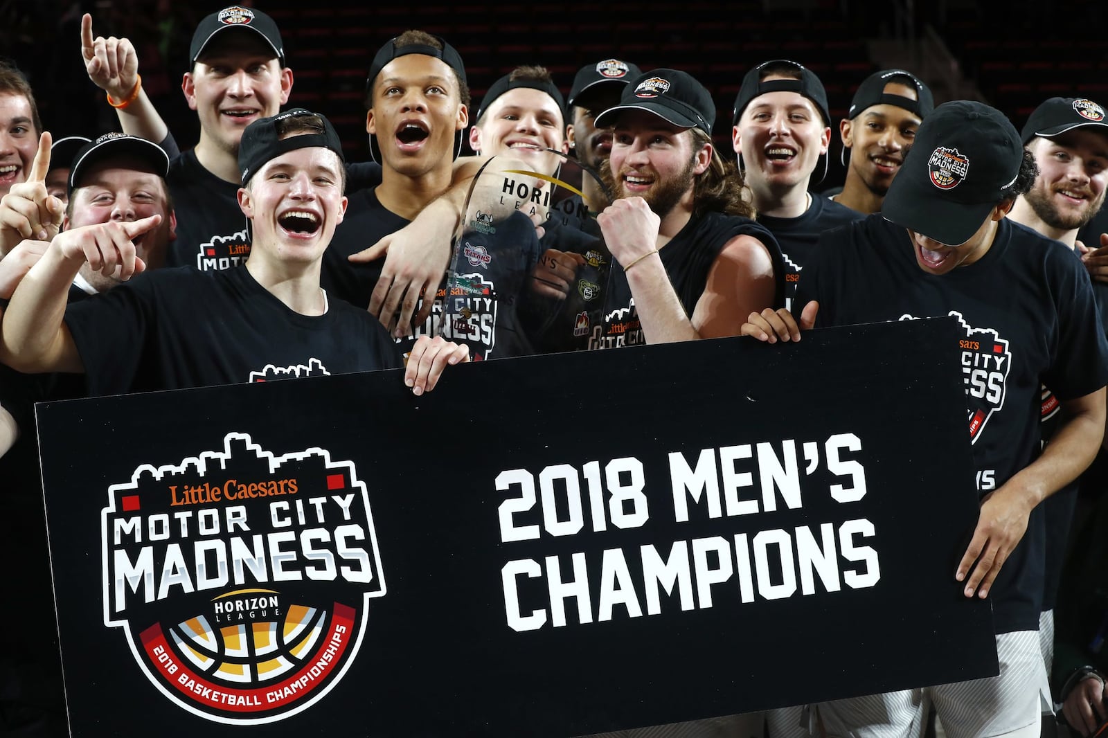 Wright State players celebrate a 74-57 win over Cleveland State during an NCAA college basketball game for the championship in the Horizon League men’s tournament in Detroit, Tuesday, March 6, 2018. (AP Photo/Paul Sancya)