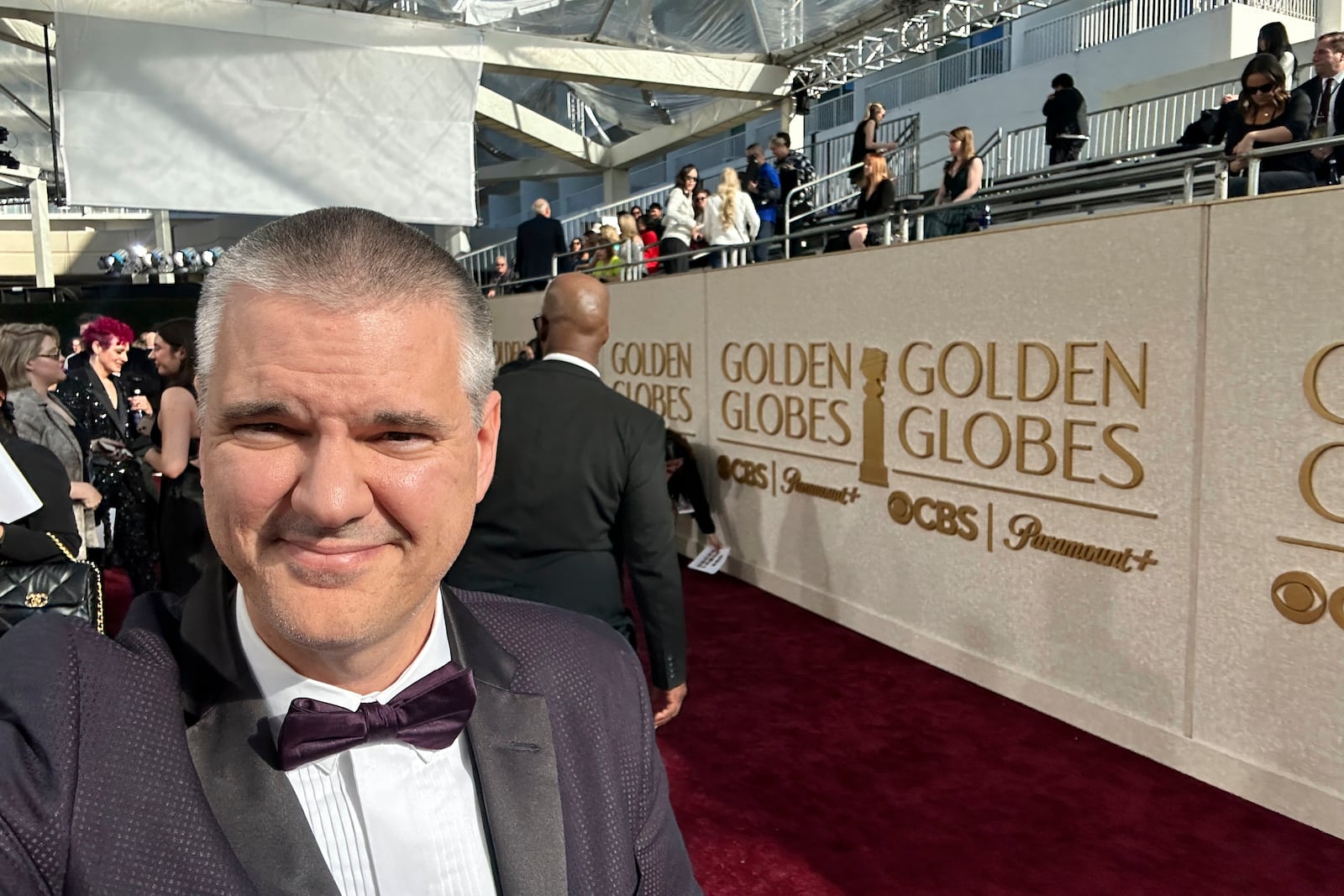 Ryan Pearson, a Los Angeles-based entertainment video editor for The Associated Press, on the red carpet at the Golden Globes in Los Angeles, Sunday, Jan. 5, 2025. (AP Photo/Ryan Pearson)