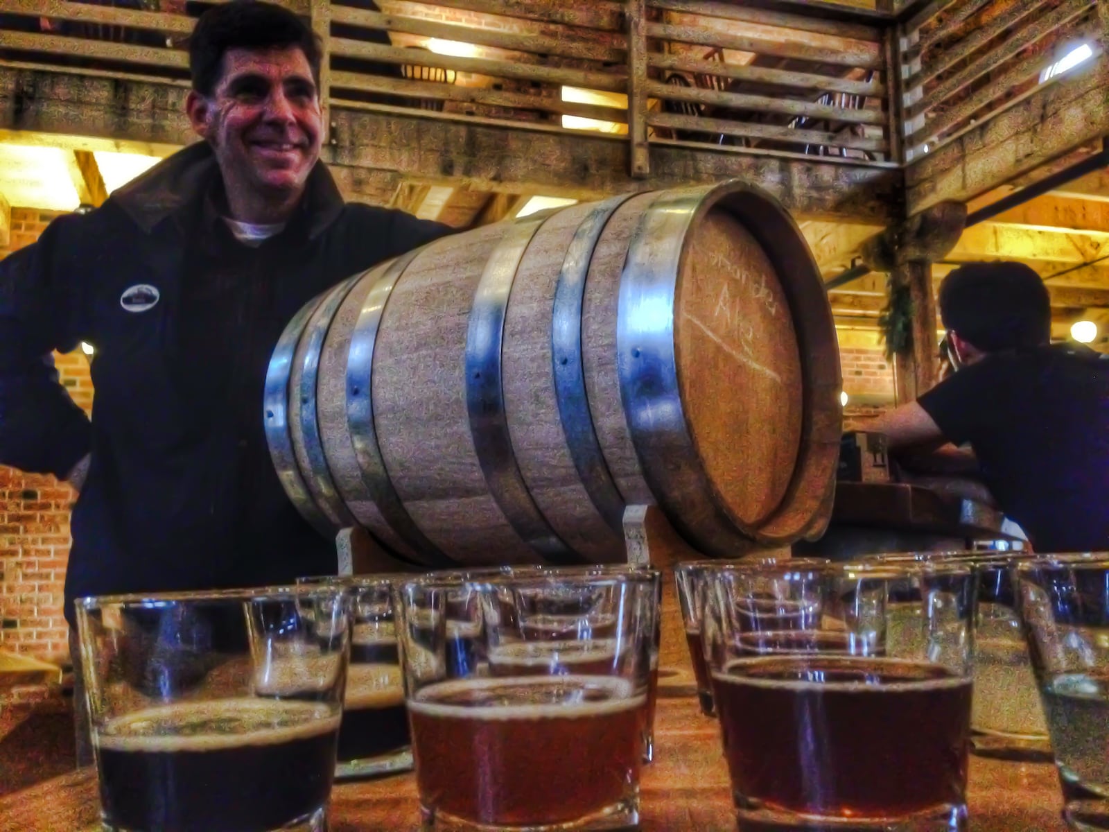 Brady Kress, president and CEO of Carillon Historical Park, stands besides a keg of beer along with samples at the Carillon Brewing Company museum/restaurant. CONNIE POST/FILE PHOTO