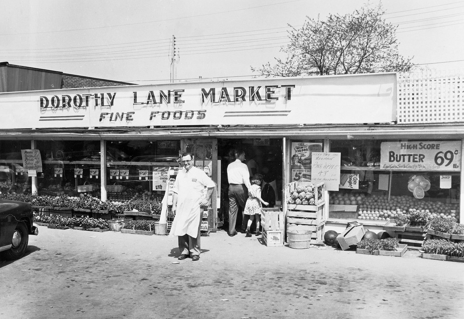 Calvin D. Mayne poses in front of Dorothy Lane Market in 1949. 