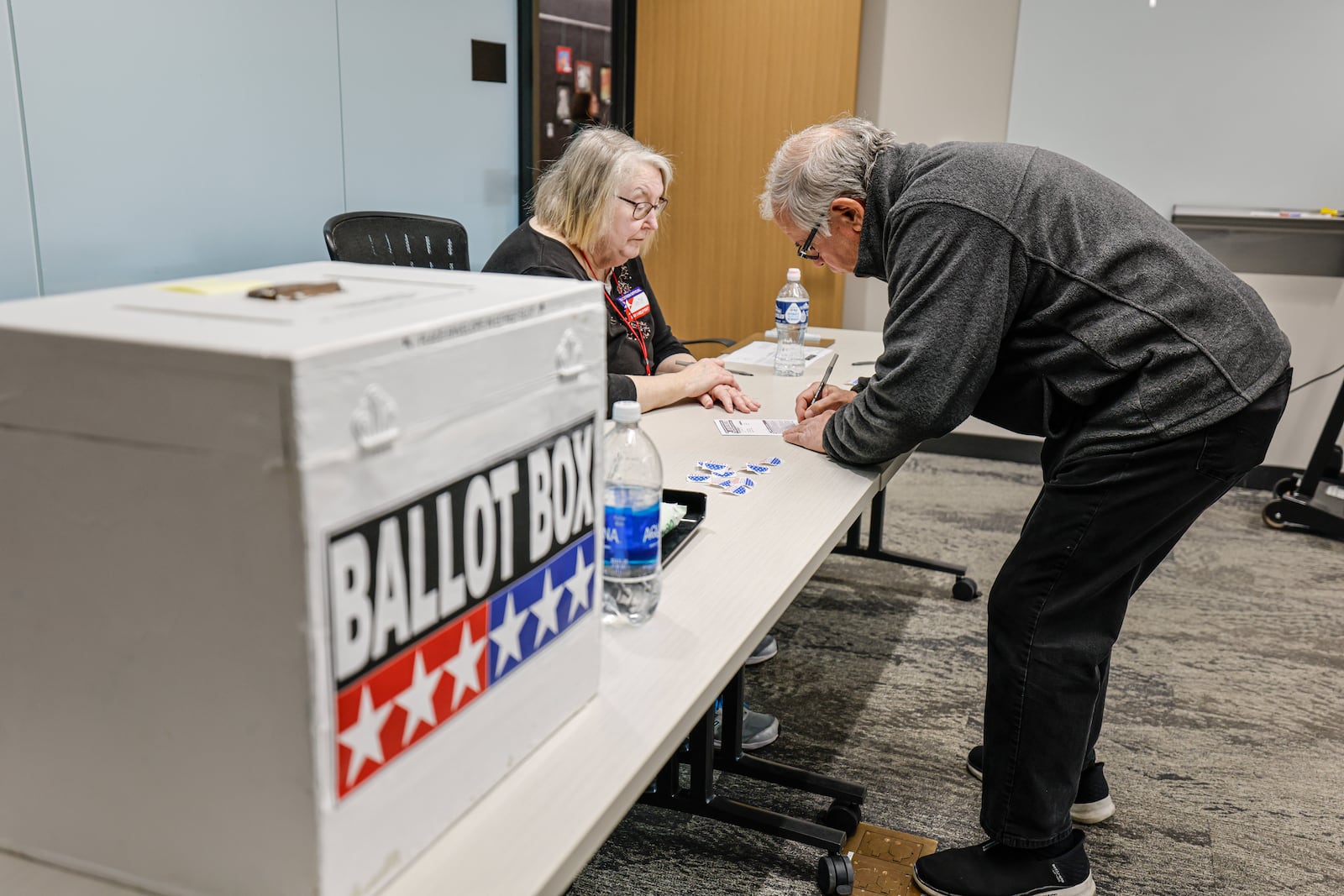 A voter casts a ballot during early voting in Waukesha, Wis., Tuesday, March 18, 2025. (AP Photo/Jeffrey Phelps)