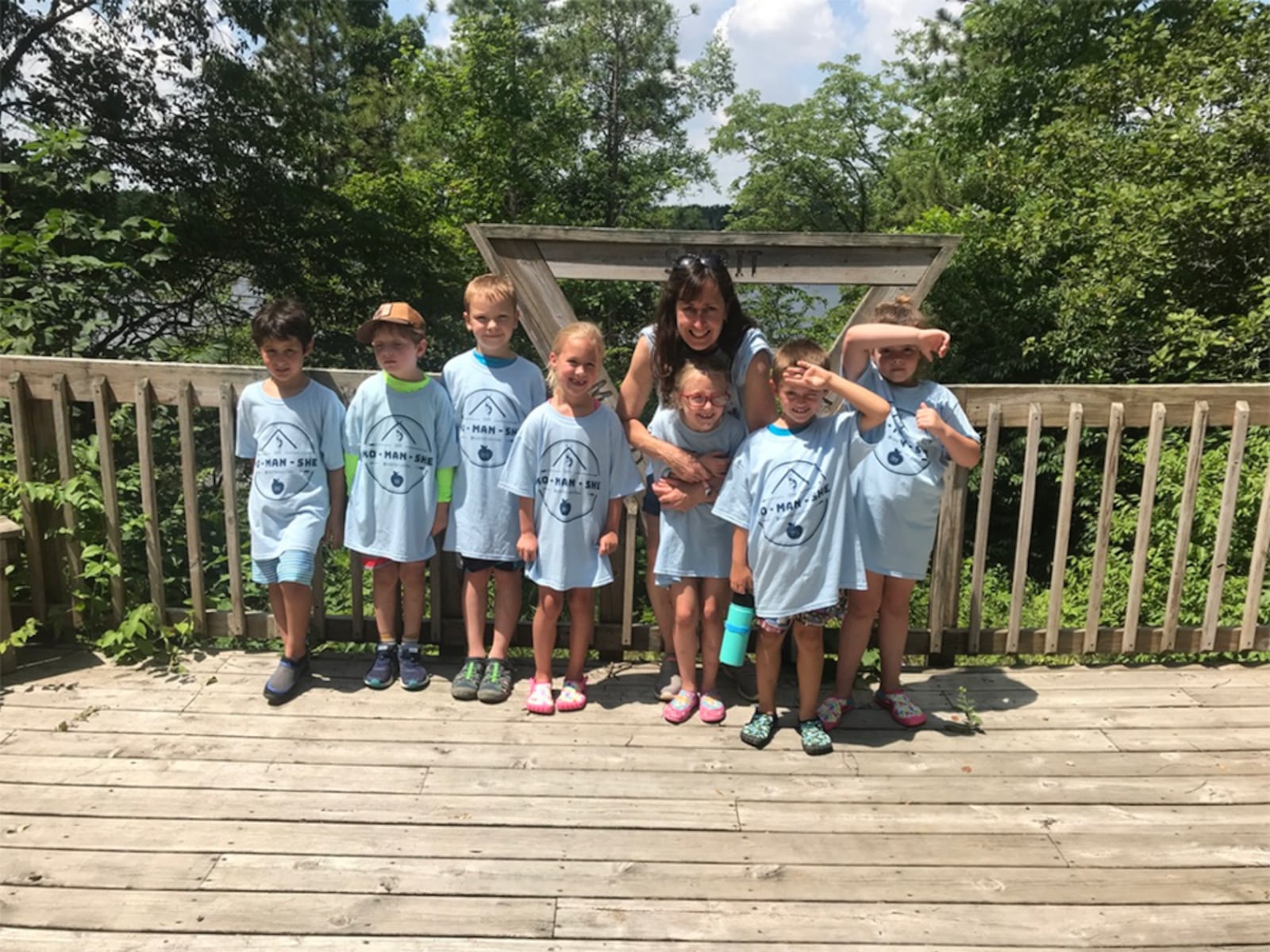 Linda Duval (back) at Camp Ko-Man-She day camp in 2019 with some  young campers. CONTRIBUTED