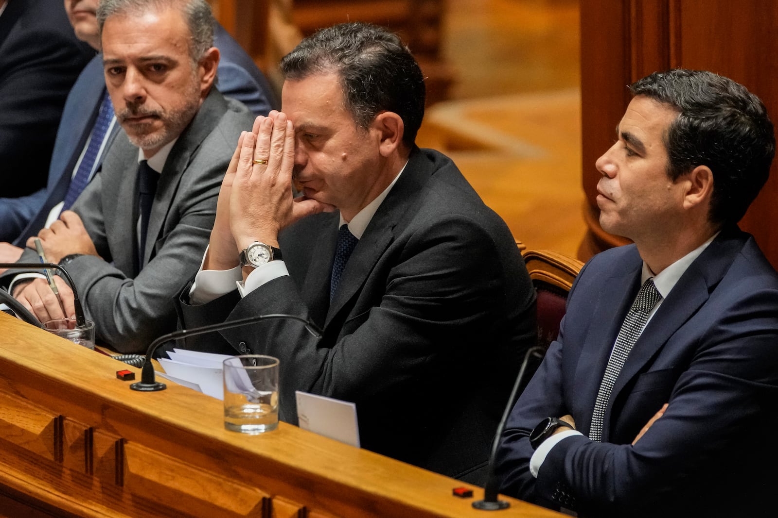 Portuguese Prime Minister Luis Montenegro, second right, gestures during a debate preceding a confidence motion vote at the Portuguese parliament in Lisbon, Tuesday, March 11, 2025. (AP Photo/Armando Franca)