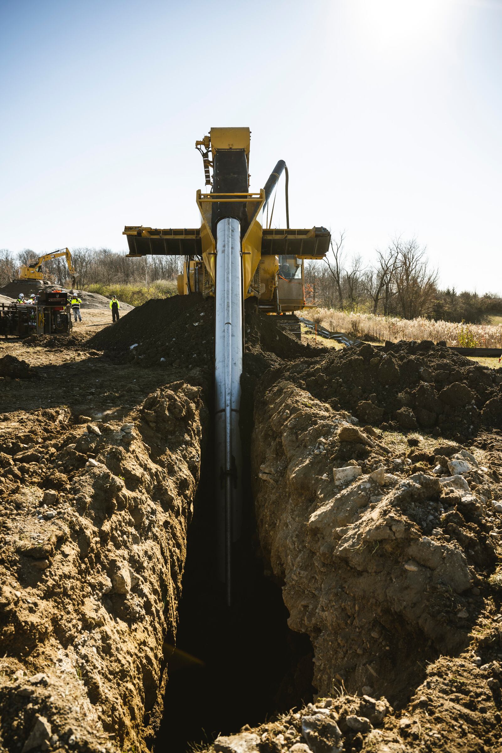 A DeWind construction worker uses the trencher Nov. 21 to dig a 30-foot-deep trench at Wright-Patterson Air Force Base. The trencher digs, lays the pipe and fills the trench in one efficient and environmentally friendly pass. (U.S. Air Force photo by Hannah Carranza)