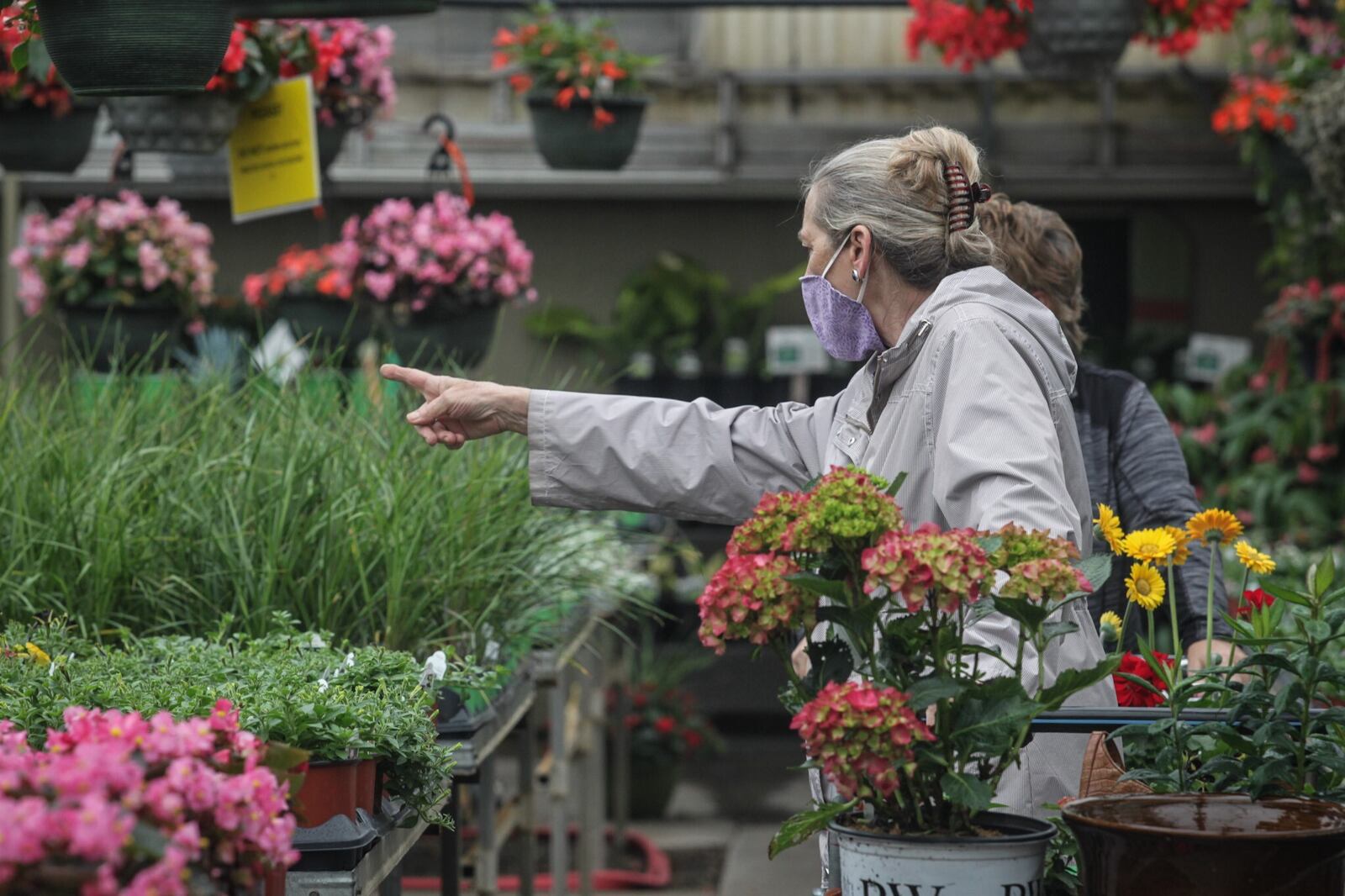 Shoppers buy vegetables and flowers at Stockslagers Greenhouse and Garden Center. Staff photo: Jim Noelker