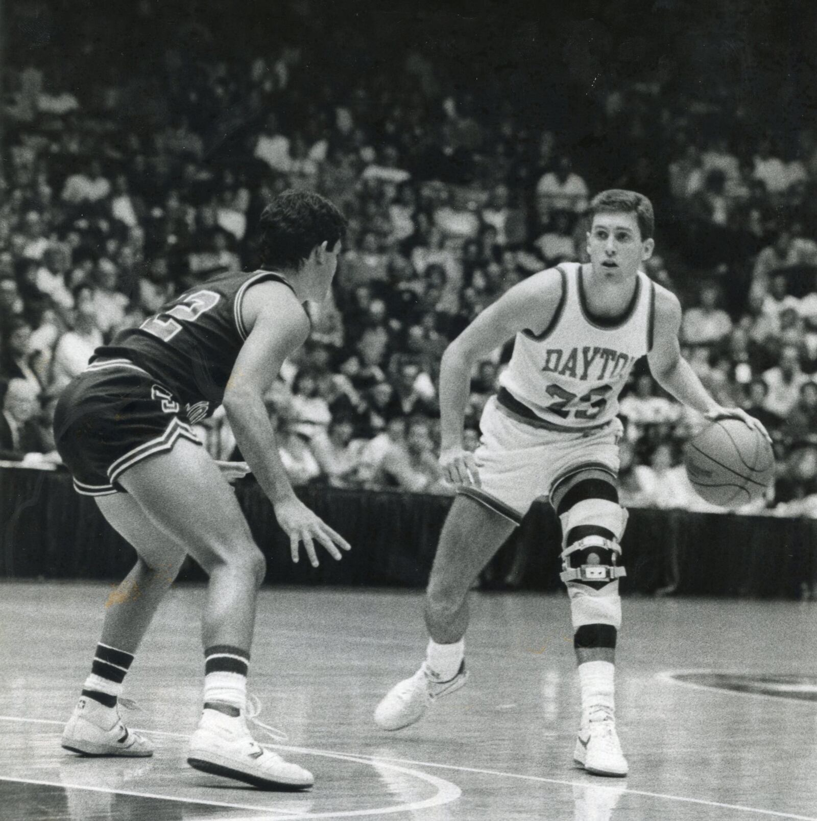 Dayton's Norm Grevey, right, dribbles in a game at UD Arena. Photo courtesy of UD