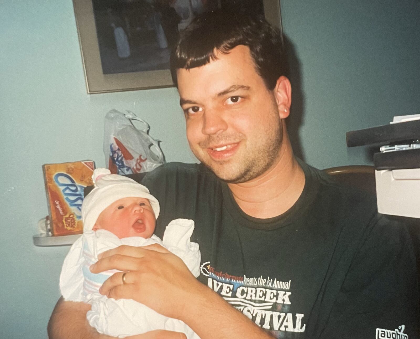 Matevia with newborn daughter Riley in 1997. The family returned to Ohio in 2001 and Matevia began to gain weight while staying at home to care for his children. SUBMITTED PHOTO