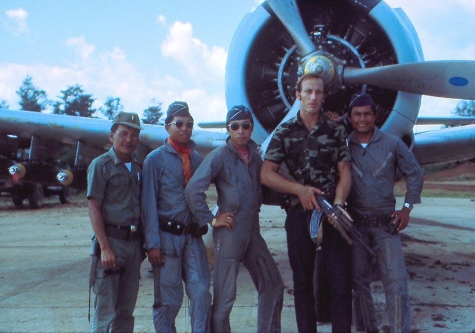 Lieutenant Gene Hamner (second from right) with allied Laotian troops during the Vietnam War. CONTRIBUTED