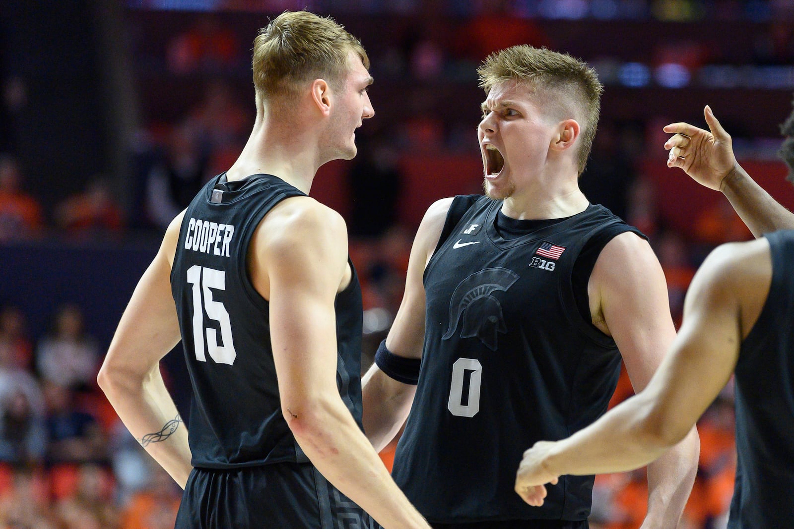 Michigan State's Carson Cooper, left, and Jaxon Kohler celebrate during the second half of an NCAA college basketball game against Illinois, Saturday, Feb. 15, 2025, in Champaign, Ill. (AP Photo/Craig Pessman)