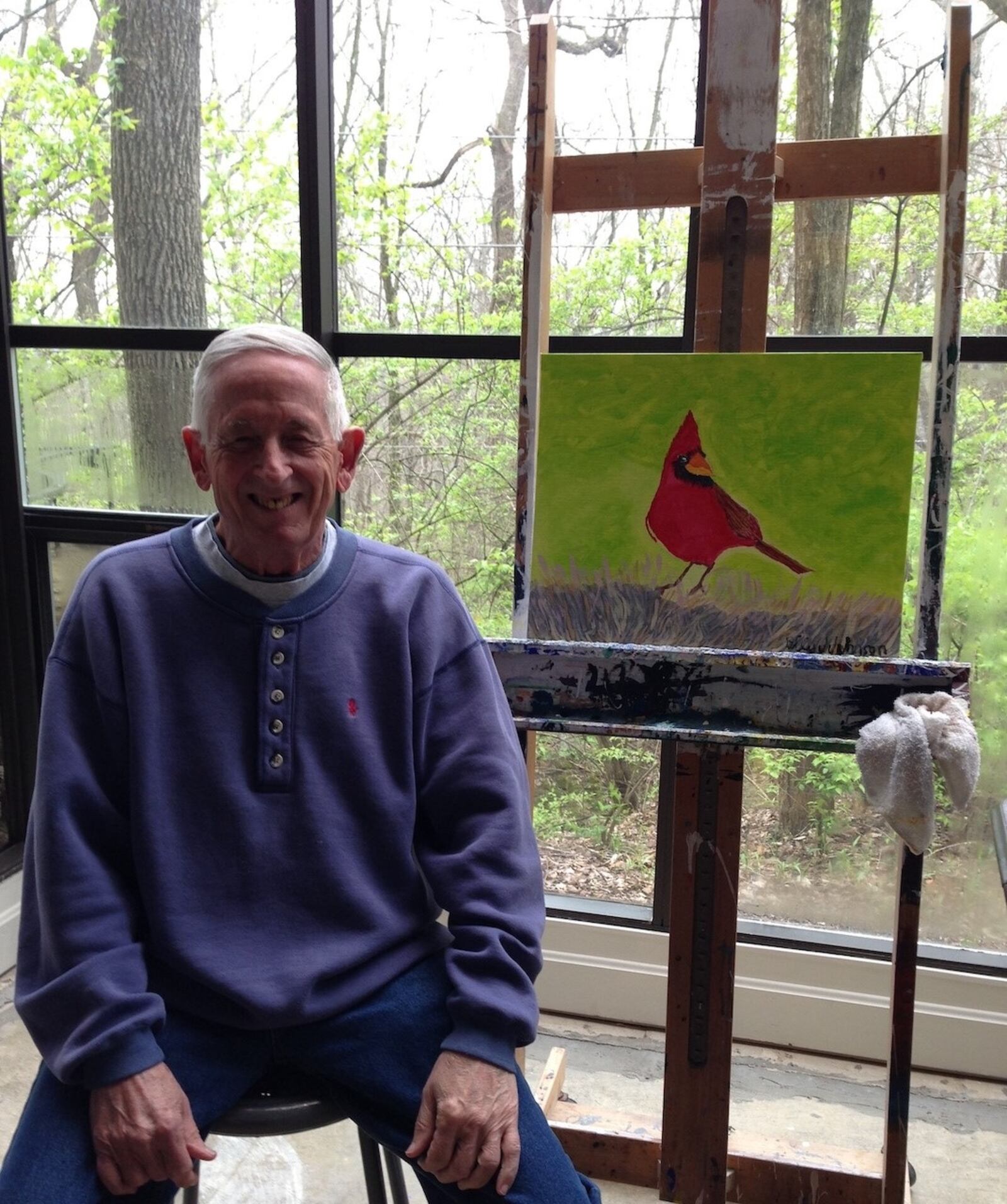 Karen Fisher’s father, Billy Joe Johnson, suffered from Alzheimer’s and is pictured with his cardinal painting. CONTRIBUTED