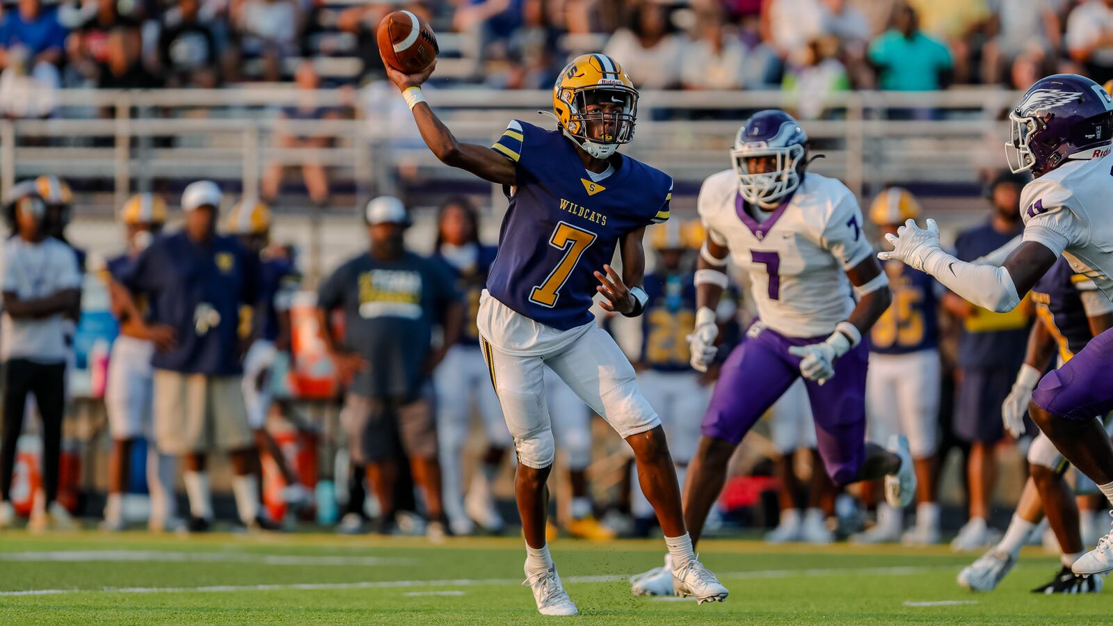 Springfield High School sophomore Braylon Keyes rolls out to pass during their game against Gonzaga College High School on Friday night at Springfield High School. The Wildcats fell 14-6. Michael Cooper/CONTRIBUTED