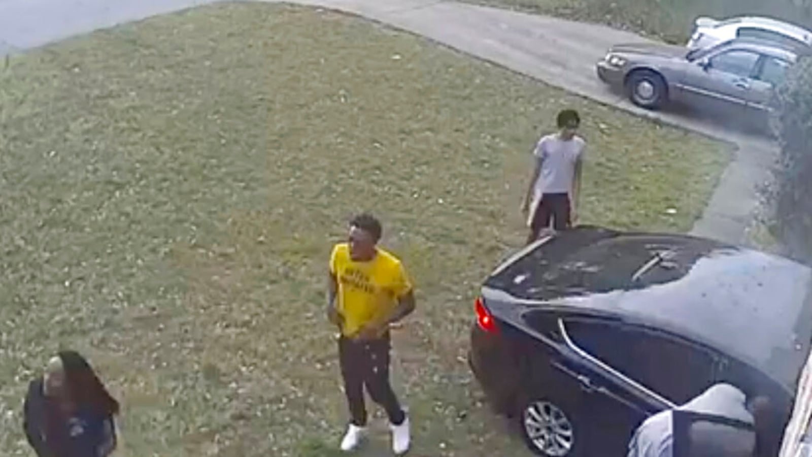 This video frame grab made available by attorney Chris Stewart shows the driver, center, of a speeding car, after it hit LaDerihanna Holmes, 9, as she played in her front yard Friday, March 29, 2019 in Lithonia, Georgia.