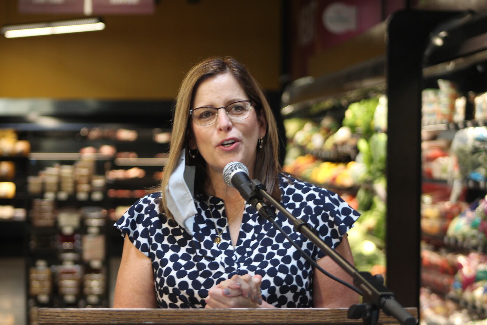 Debbie Serenius, director of health partnerships with Produce Perks Midwest, speaks on Wednesday about the Produce Perks program at Gem City Market. CORNELIUS FROLIK / STAFF